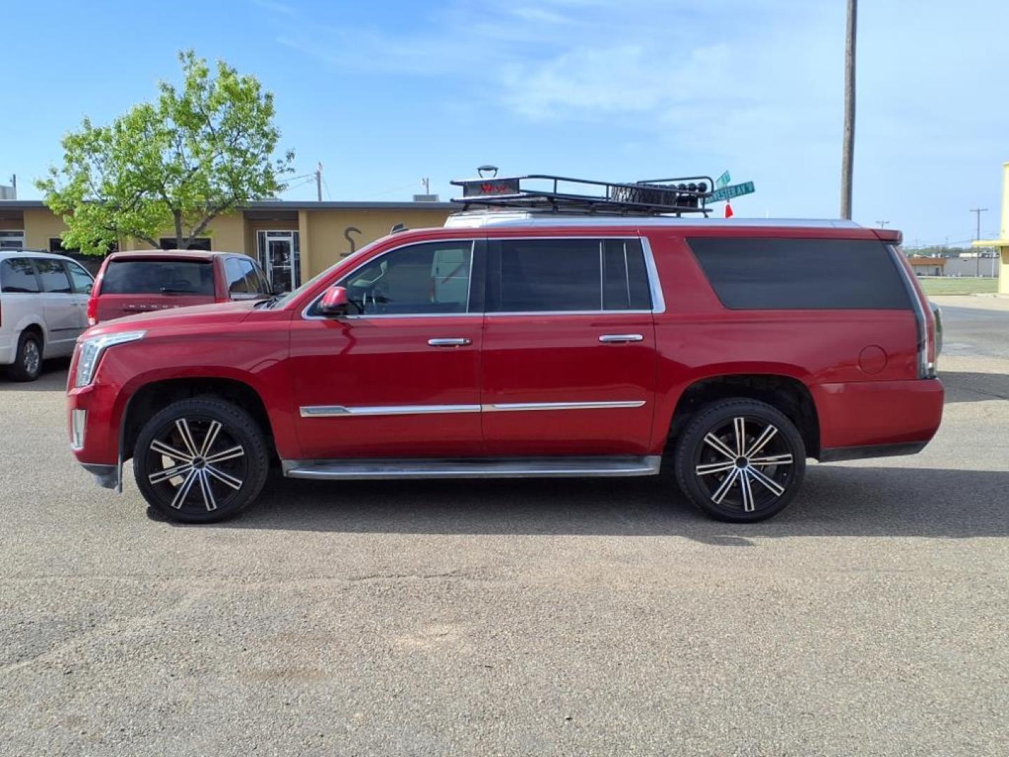 2015 Crystal Red Tintcoat Gbe Cadillac Escalade ESV Luxury (1GYS4HKJ8FR) with an 6.2L EcoTec3 6.2L V8 420hp 460ft. lbs. Direct Injection engine, 6-Speed Shiftable Automatic transmission, located at 1401 N. Hobart, Pampa, TX, 79065, (806) 665-9872, 35.549953, -100.975098 - Photo#4