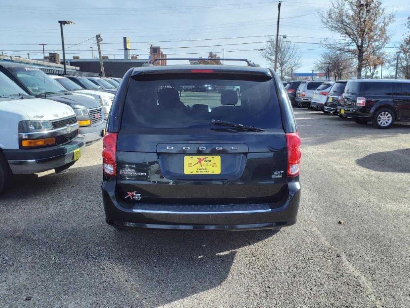 2014 Brilliant Black Crystal Pearl Coat Pxr Dodge Grand Caravan SXT (2C4RDGCGXER) with an 3.6L Pentastar 3.6L Flex Fuel V6 283hp 260ft. lbs. Sequential Multiport Fuel Injection engine, 6-Speed Shiftable Automatic transmission, located at 1401 N. Hobart, Pampa, TX, 79065, (806) 665-9872, 35.549953, -100.975098 - Photo#3