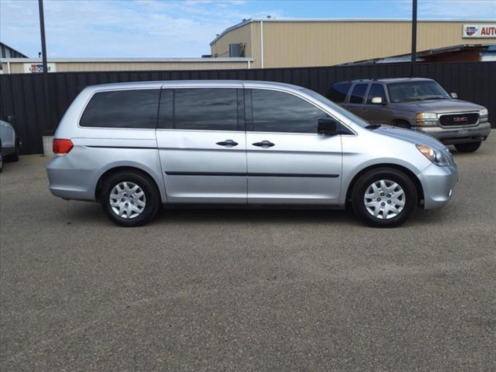 2010 Alabaster Silver Metallic Honda Odyssey LX (5FNRL3H24AB) with an 3.5L 3.5L V6 244hp 240ft. lbs. Sequential Multiport Fuel Injection engine, 5-Speed Automatic transmission, located at 1401 N. Hobart, Pampa, TX, 79065, (806) 665-9872, 35.549641, -100.971878 - Photo #1