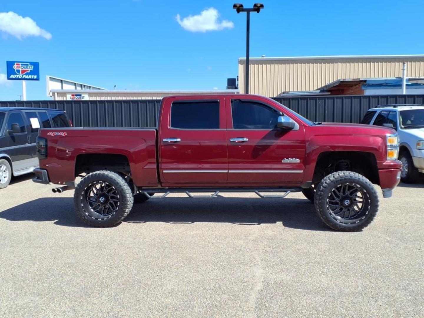 2014 Deep Ruby Metallic Chevrolet Silverado 1500 High Country (3GCUKTEC3EG) with an 5.3L EcoTec3 5.3L Flex Fuel V8 355hp 383ft. lbs. Direct Injection engine, 6-Speed Shiftable Automatic w/Overdrive transmission, located at 1401 N. Hobart, Pampa, TX, 79065, (806) 665-9872, 35.549953, -100.975098 - Photo#2