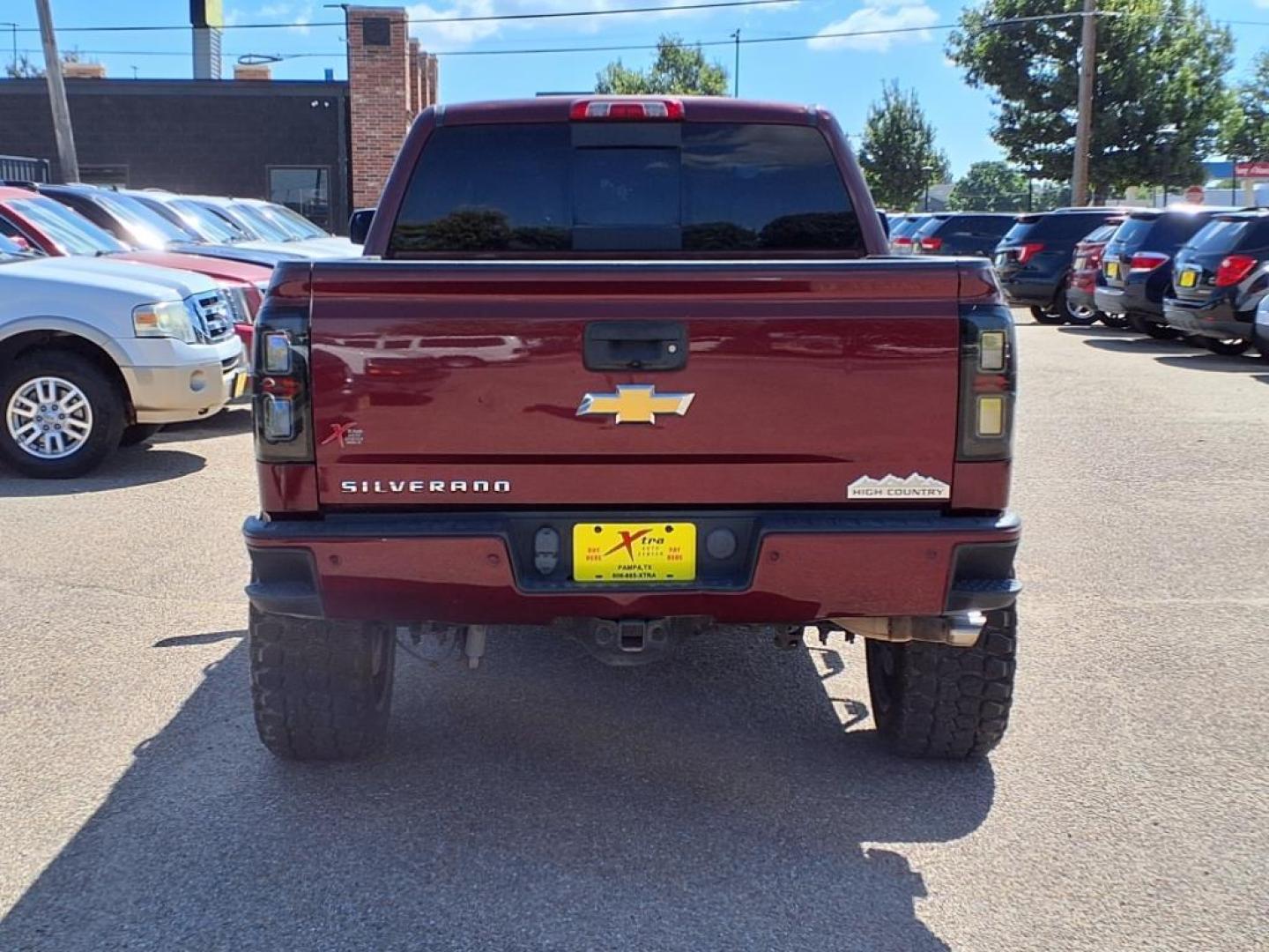 2014 Deep Ruby Metallic Chevrolet Silverado 1500 High Country (3GCUKTEC3EG) with an 5.3L EcoTec3 5.3L Flex Fuel V8 355hp 383ft. lbs. Direct Injection engine, 6-Speed Shiftable Automatic w/Overdrive transmission, located at 1401 N. Hobart, Pampa, TX, 79065, (806) 665-9872, 35.549953, -100.975098 - Photo#3