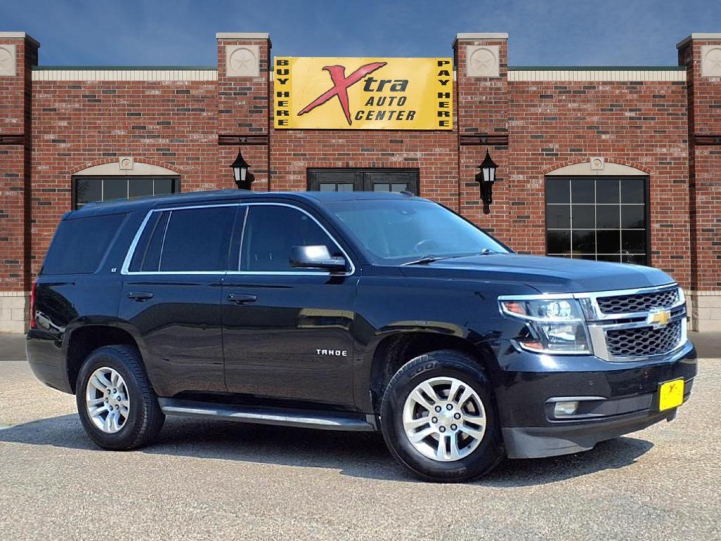 2015 Black Chevrolet Tahoe LT (1GNSCBKC4FR) with an 5.3L EcoTec3 5.3L Flex Fuel V8 355hp 383ft. lbs. Direct Injection engine, 6-Speed Shiftable Automatic w/Overdrive transmission, located at 1401 N. Hobart, Pampa, TX, 79065, (806) 665-9872, 35.549953, -100.975098 - Photo#0