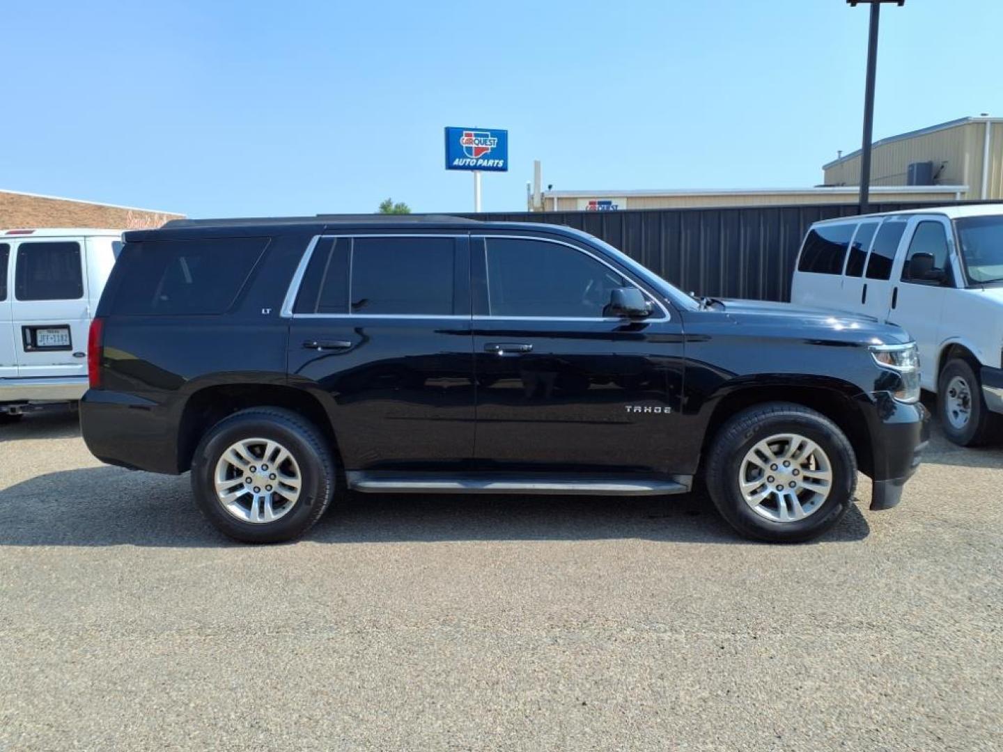 2015 Black Chevrolet Tahoe LT (1GNSCBKC4FR) with an 5.3L EcoTec3 5.3L Flex Fuel V8 355hp 383ft. lbs. Direct Injection engine, 6-Speed Shiftable Automatic w/Overdrive transmission, located at 1401 N. Hobart, Pampa, TX, 79065, (806) 665-9872, 35.549953, -100.975098 - Photo#2