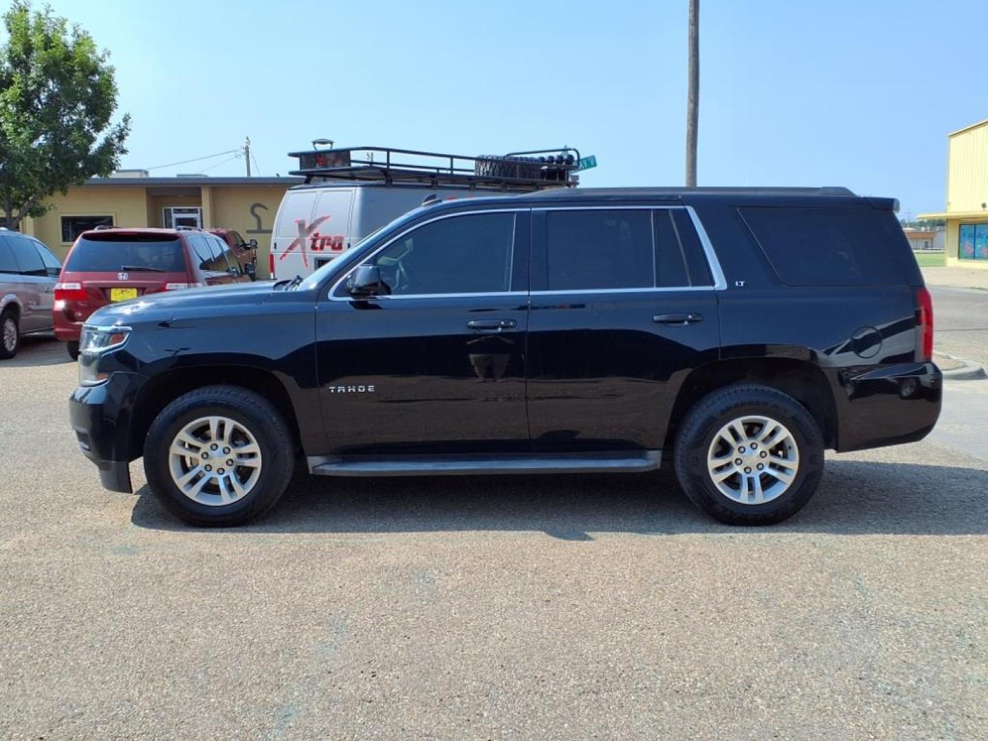 2015 Black Chevrolet Tahoe LT (1GNSCBKC4FR) with an 5.3L EcoTec3 5.3L Flex Fuel V8 355hp 383ft. lbs. Direct Injection engine, 6-Speed Shiftable Automatic w/Overdrive transmission, located at 1401 N. Hobart, Pampa, TX, 79065, (806) 665-9872, 35.549953, -100.975098 - Photo#4