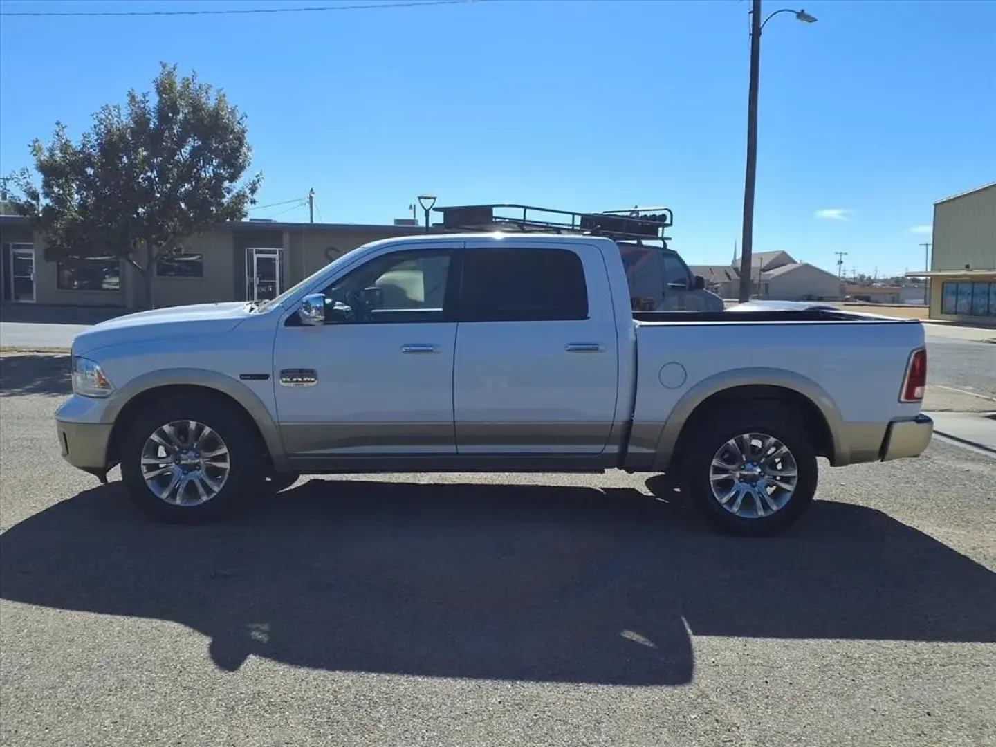 2015 Bright White Clear Coat/White Gold Clear Coat Ram 1500 Longhorn Crew Cab SWB 4WD (1C6RR7PM3FS) with an Other engine, located at 1401 N. Hobart, Pampa, TX, 79065, (806) 665-9872, 35.549953, -100.975098 - Unleash your adventurous spirit with the 2015 Ram 1500 Longhorn Crew Cab SWB 4WD, a perfect companion for weekend getaways or your daily commute in and around Pampa, TX. Whether you need a reliable truck for hauling cargo or a spacious vehicle for family outings, this versatile pickup is designed to - Photo#4