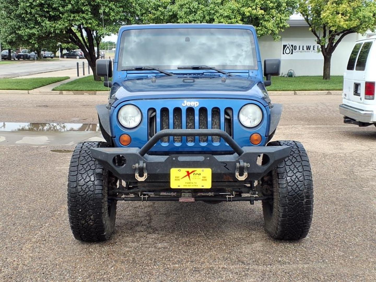 2009 Deep Water Blue Pearl Coat Jeep Wrangler Unlimited X (1J4GA39169L) with an 3.8L 3.8L V6 205hp 240ft. lbs. Sequential Multiport Fuel Injection engine, 6-Speed Manual transmission, located at 1401 N. Hobart, Pampa, TX, 79065, (806) 665-9872, 35.549953, -100.975098 - Photo#1