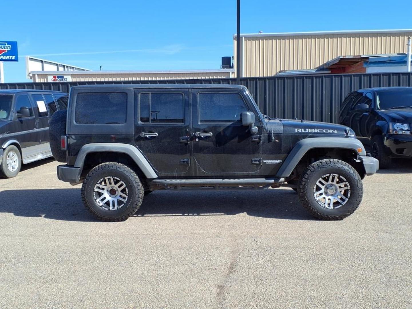 2011 Black Clear Coat Px8 Jeep Wrangler Unlimited Rubicon (1J4HA6H19BL) with an 3.8L 3.8L V6 202hp 237ft. lbs. Sequential Multiport Fuel Injection engine, 4-Speed Automatic transmission, located at 1401 N. Hobart, Pampa, TX, 79065, (806) 665-9872, 35.549953, -100.975098 - Photo#2