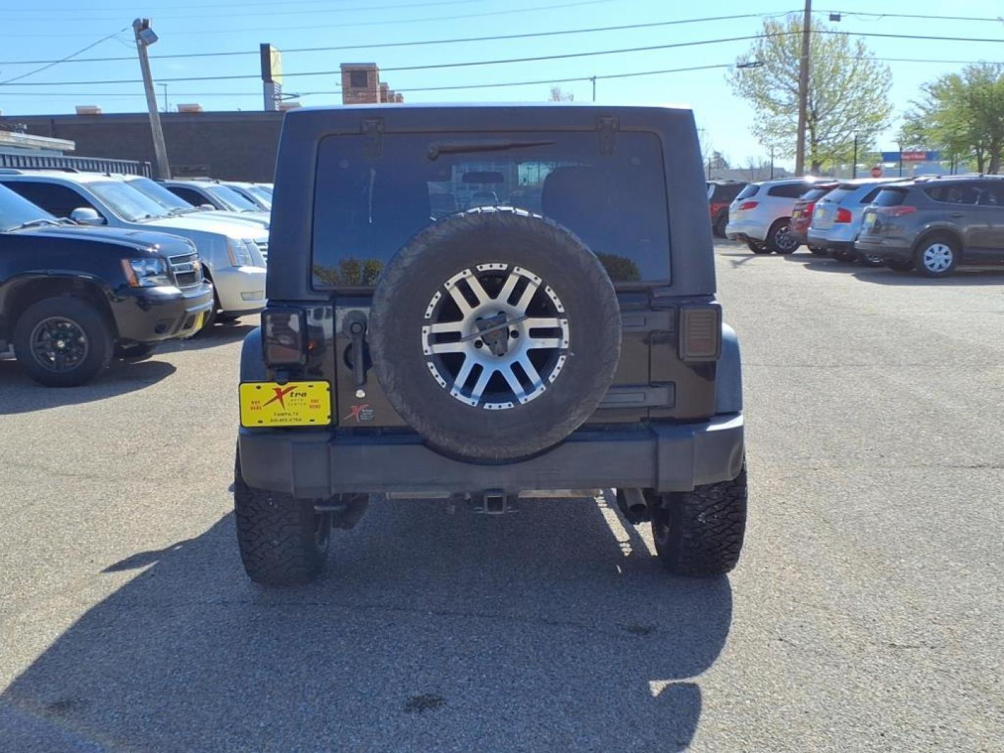 2011 Black Clear Coat Px8 Jeep Wrangler Unlimited Rubicon (1J4HA6H19BL) with an 3.8L 3.8L V6 202hp 237ft. lbs. Sequential Multiport Fuel Injection engine, 4-Speed Automatic transmission, located at 1401 N. Hobart, Pampa, TX, 79065, (806) 665-9872, 35.549953, -100.975098 - Photo#3