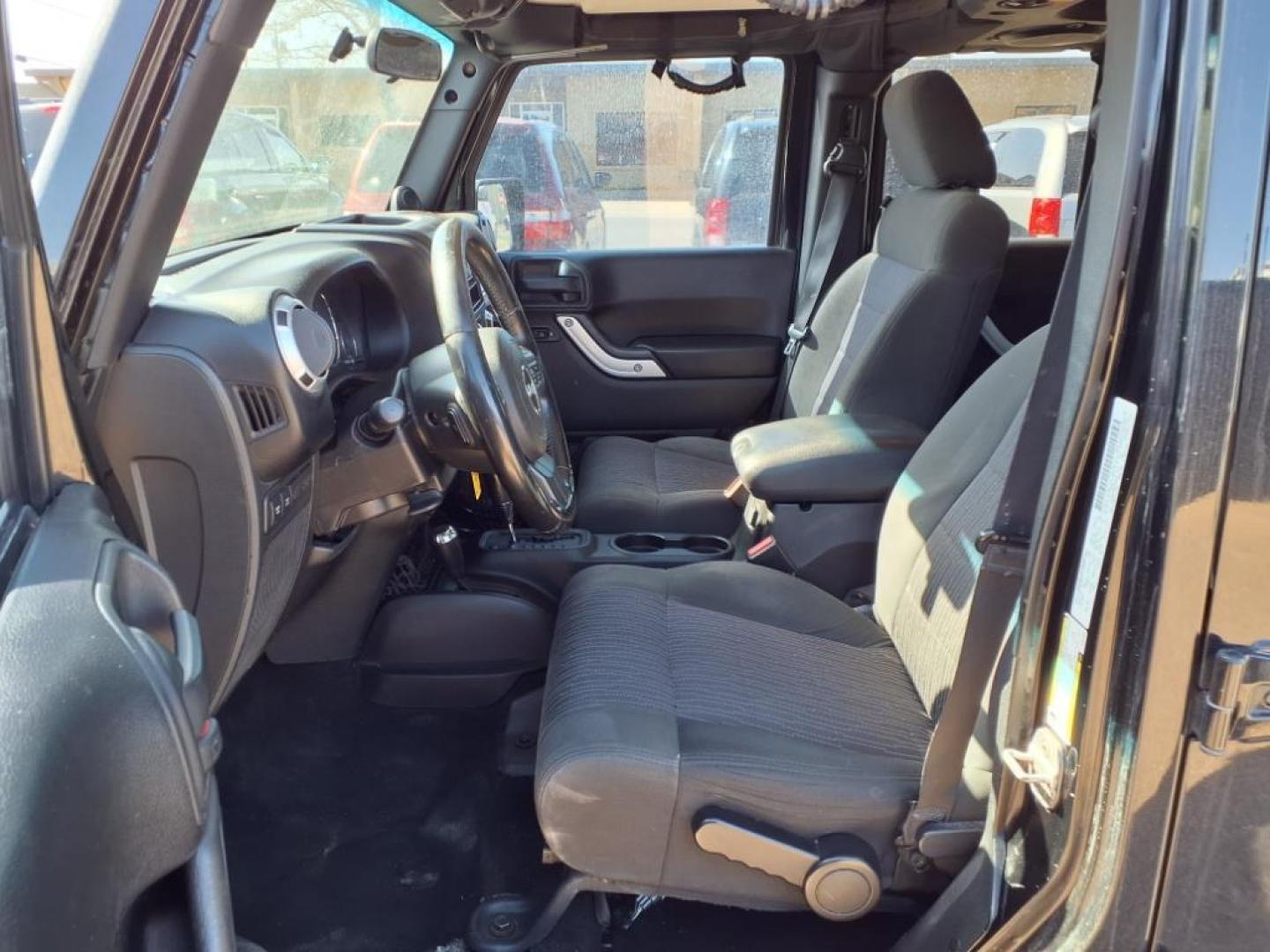 2011 Black Clear Coat Px8 Jeep Wrangler Unlimited Rubicon (1J4HA6H19BL) with an 3.8L 3.8L V6 202hp 237ft. lbs. Sequential Multiport Fuel Injection engine, 4-Speed Automatic transmission, located at 1401 N. Hobart, Pampa, TX, 79065, (806) 665-9872, 35.549953, -100.975098 - Photo#11