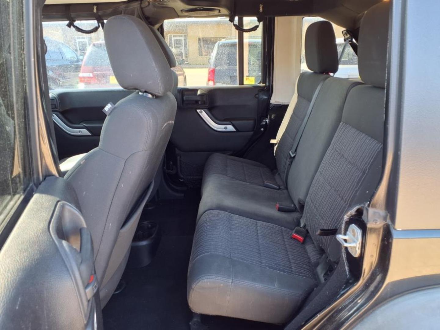 2011 Black Clear Coat Px8 Jeep Wrangler Unlimited Rubicon (1J4HA6H19BL) with an 3.8L 3.8L V6 202hp 237ft. lbs. Sequential Multiport Fuel Injection engine, 4-Speed Automatic transmission, located at 1401 N. Hobart, Pampa, TX, 79065, (806) 665-9872, 35.549953, -100.975098 - Photo#12