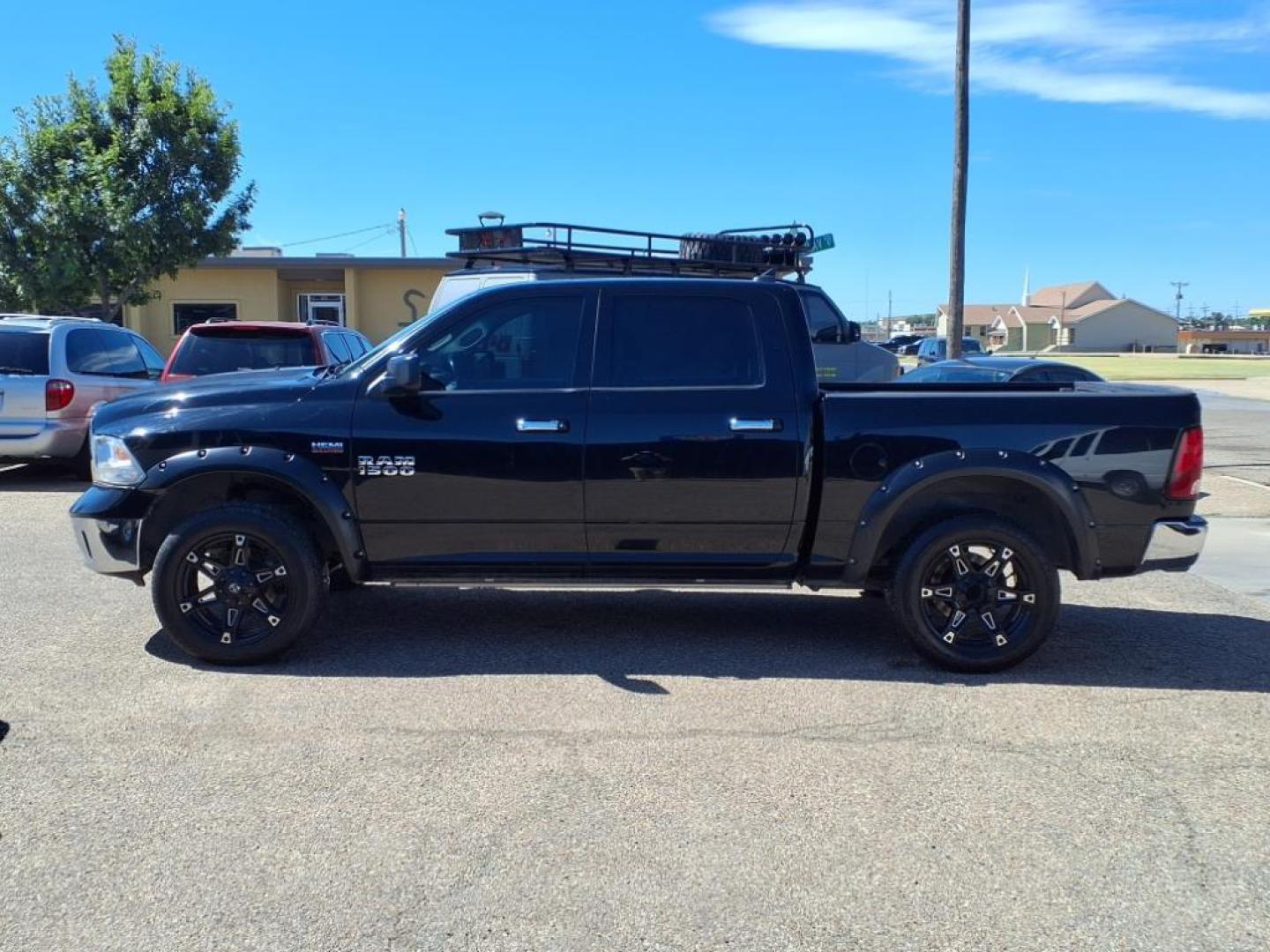 2014 Black Clear Coat RAM 1500 Big Horn (1C6RR7LT1ES) with an 5.7L HEMI 5.7L V8 395hp 407ft. lbs. Sequential Multiport Fuel Injection engine, 8-Speed Shiftable Automatic transmission, located at 1401 N. Hobart, Pampa, TX, 79065, (806) 665-9872, 35.549953, -100.975098 - Photo#4