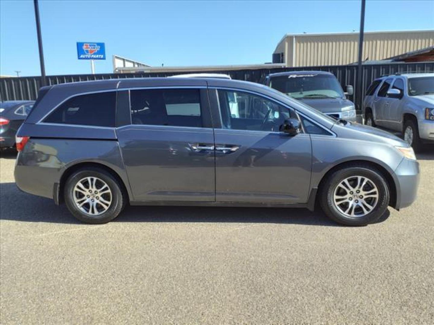 2012 Polished Metal Metallic Honda Odyssey EX (5FNRL5H40CB) with an 3.5L 3.5L V6 248hp 250ft. lbs. Sequential Multiport Fuel Injection engine, 5-Speed Automatic transmission, located at 1401 N. Hobart, Pampa, TX, 79065, (806) 665-9872, 35.549953, -100.975098 - Photo#2