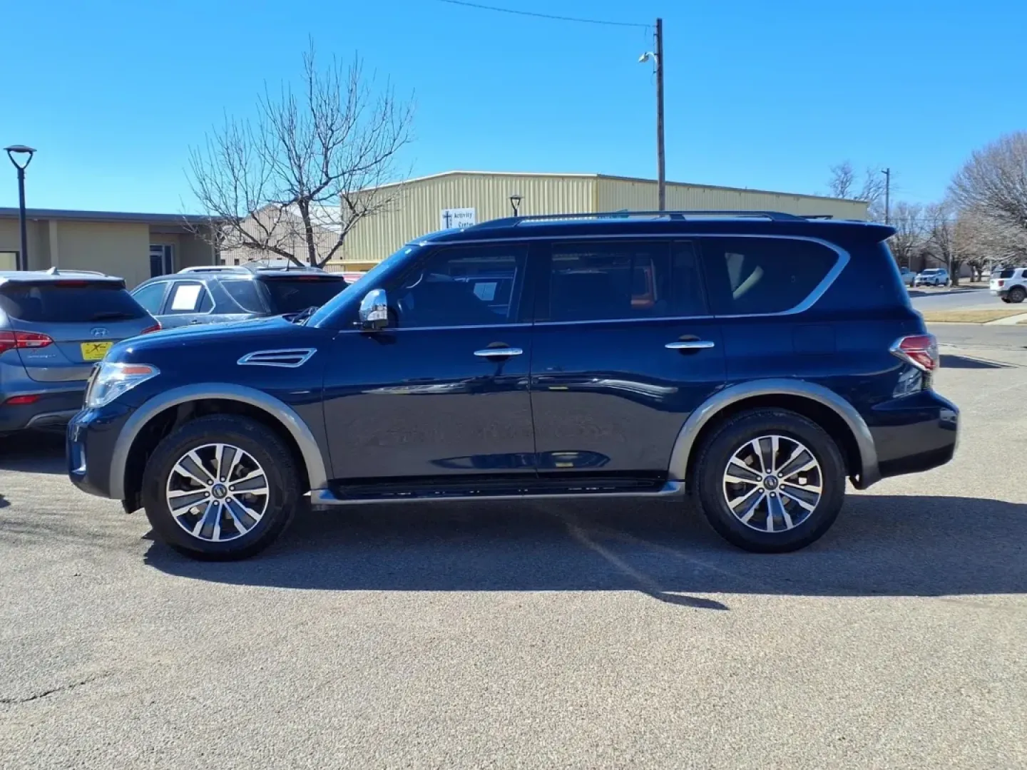 2019 Hermosa Blue Pearl Bw5 Nissan Armada SV (JN8AY2ND6K9) with an 5.6L engine, Automatic transmission, located at 1401 N. Hobart, Pampa, TX, 79065, (806) 665-9872, 35.549953, -100.975098 - Need a road-trip-ready SUV that can handle Texas highways, school drop-offs, and weekend getaways without feeling cramped? This 2019 Nissan Armada SV is built for real life-big family space, strong V8 power, and the confidence of a full-size SUV that's just as comfortable cruising through Pampa as i - Photo#4