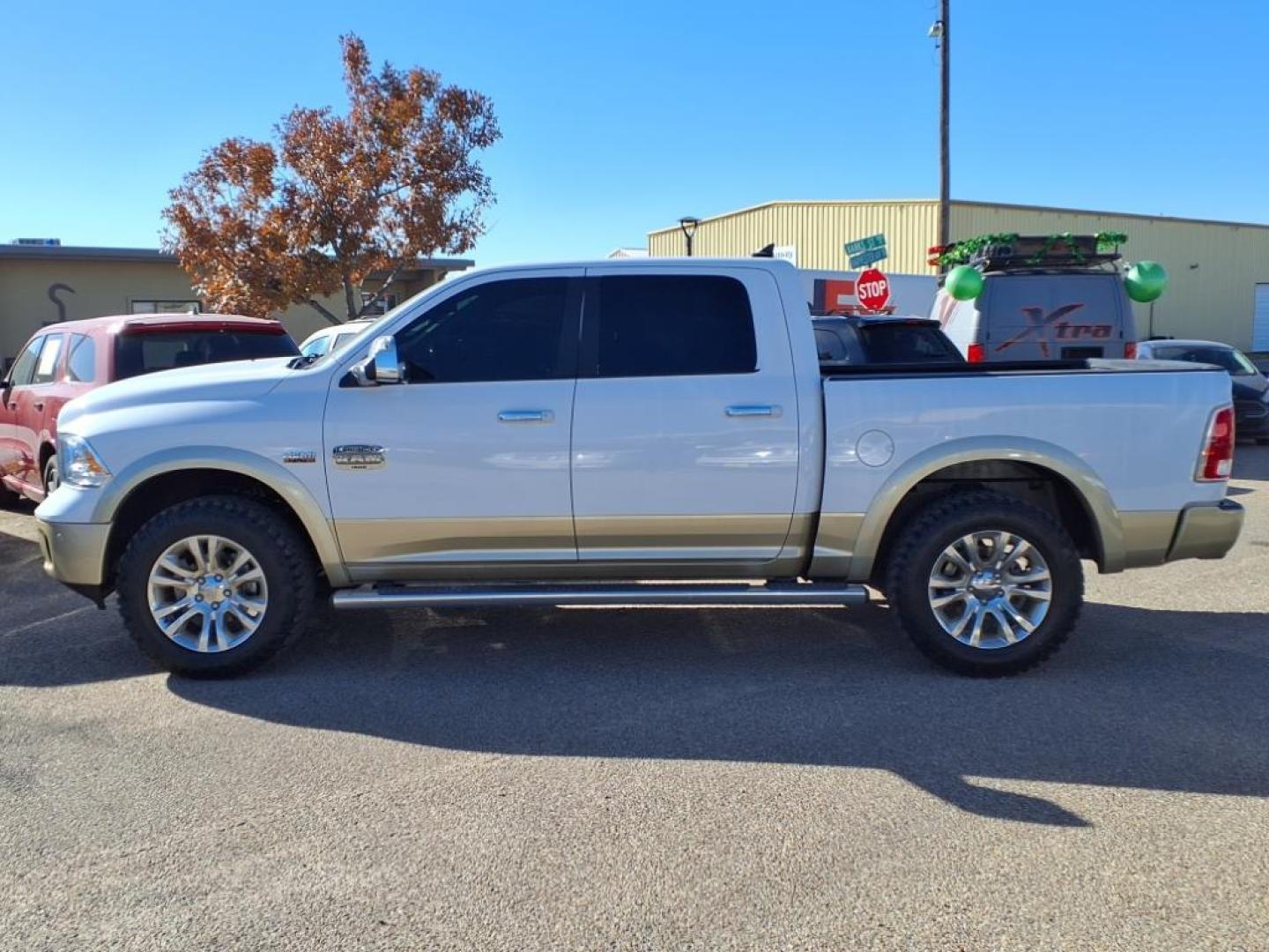 2016 Bright White Clear Coat/White Gold Clear Coat Pw7/ RAM 1500 Laramie Longhorn (1C6RR7PTXGS) with an 5.7L HEMI 5.7L V8 395hp 410ft. lbs. Sequential Multiport Fuel Injection engine, 8-Speed Shiftable Automatic transmission, located at 1401 N. Hobart, Pampa, TX, 79065, (806) 665-9872, 35.549953, -100.975098 - Photo#4