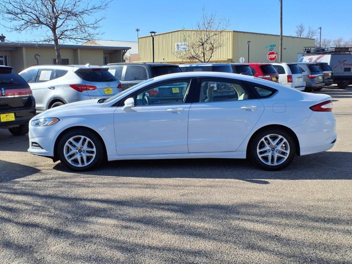 2016 Oxford White Ford Fusion SE (3FA6P0H73GR) with an 2.5L 2.5L I4 175hp 175ft. lbs. Sequential Multiport Fuel Injection engine, 6-Speed Shiftable Automatic transmission, located at 1401 N. Hobart, Pampa, TX, 79065, (806) 665-9872, 35.549953, -100.975098 - Photo#4