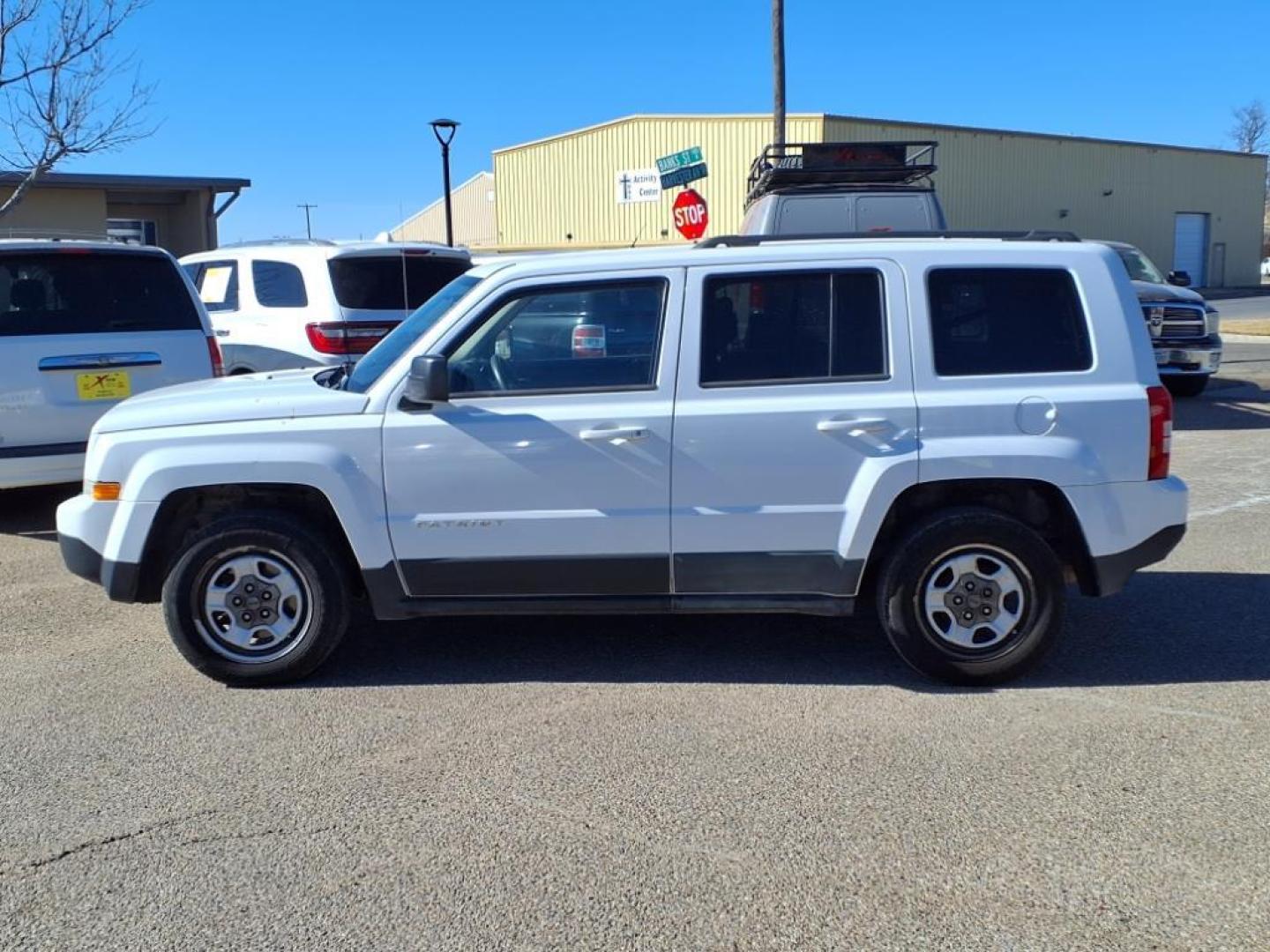 2011 Bright White Clear Coat Pw7 Jeep Patriot Sport (1J4NT1GB9BD) with an 2.4L 2.4L I4 172hp 165ft. lbs. Sequential Multiport Fuel Injection engine, CVT transmission, located at 1401 N. Hobart, Pampa, TX, 79065, (806) 665-9872, 35.549953, -100.975098 - Photo#4
