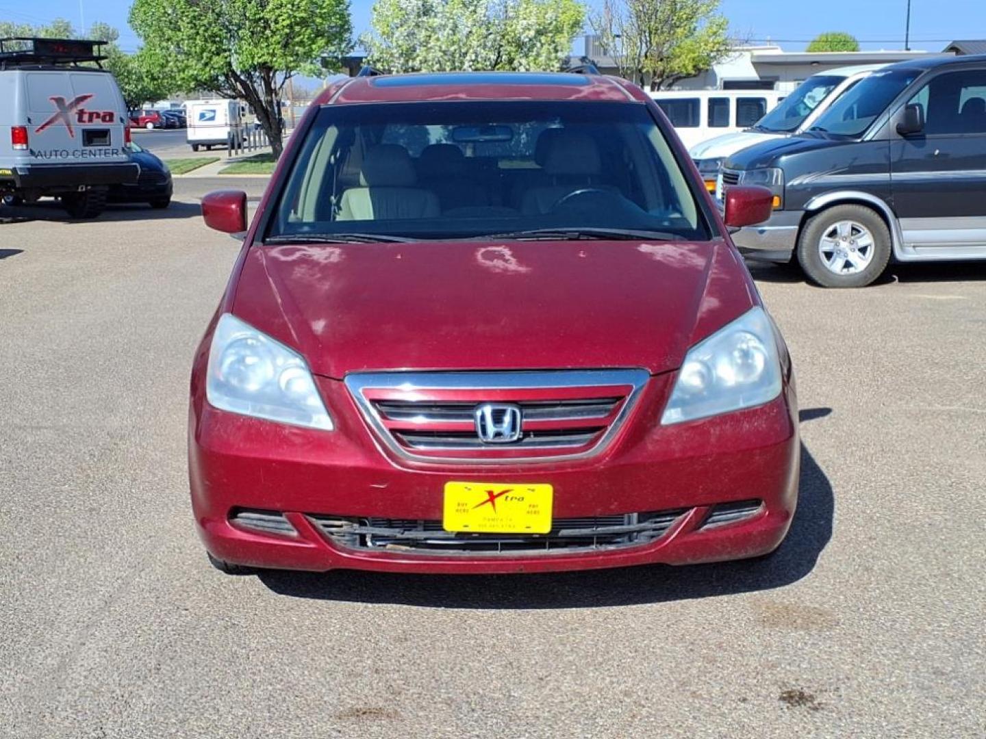 2006 Redrock Pearl Re Honda Odyssey EX-L w/DVD (5FNRL38706B) with an 3.5L 3L NA V6 single overhead cam (SOHC) 24V Fuel Injected engine, 5-Speed Automatic transmission, located at 1401 N. Hobart, Pampa, TX, 79065, (806) 665-9872, 35.549953, -100.975098 - Photo#1