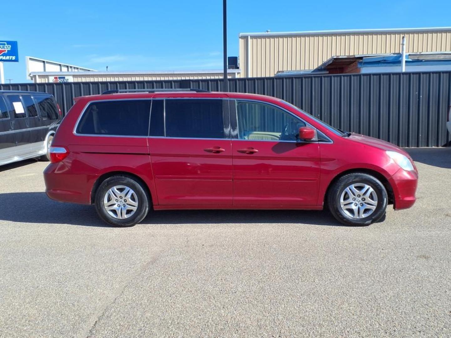 2006 Redrock Pearl Re Honda Odyssey EX-L w/DVD (5FNRL38706B) with an 3.5L 3L NA V6 single overhead cam (SOHC) 24V Fuel Injected engine, 5-Speed Automatic transmission, located at 1401 N. Hobart, Pampa, TX, 79065, (806) 665-9872, 35.549953, -100.975098 - Photo#2