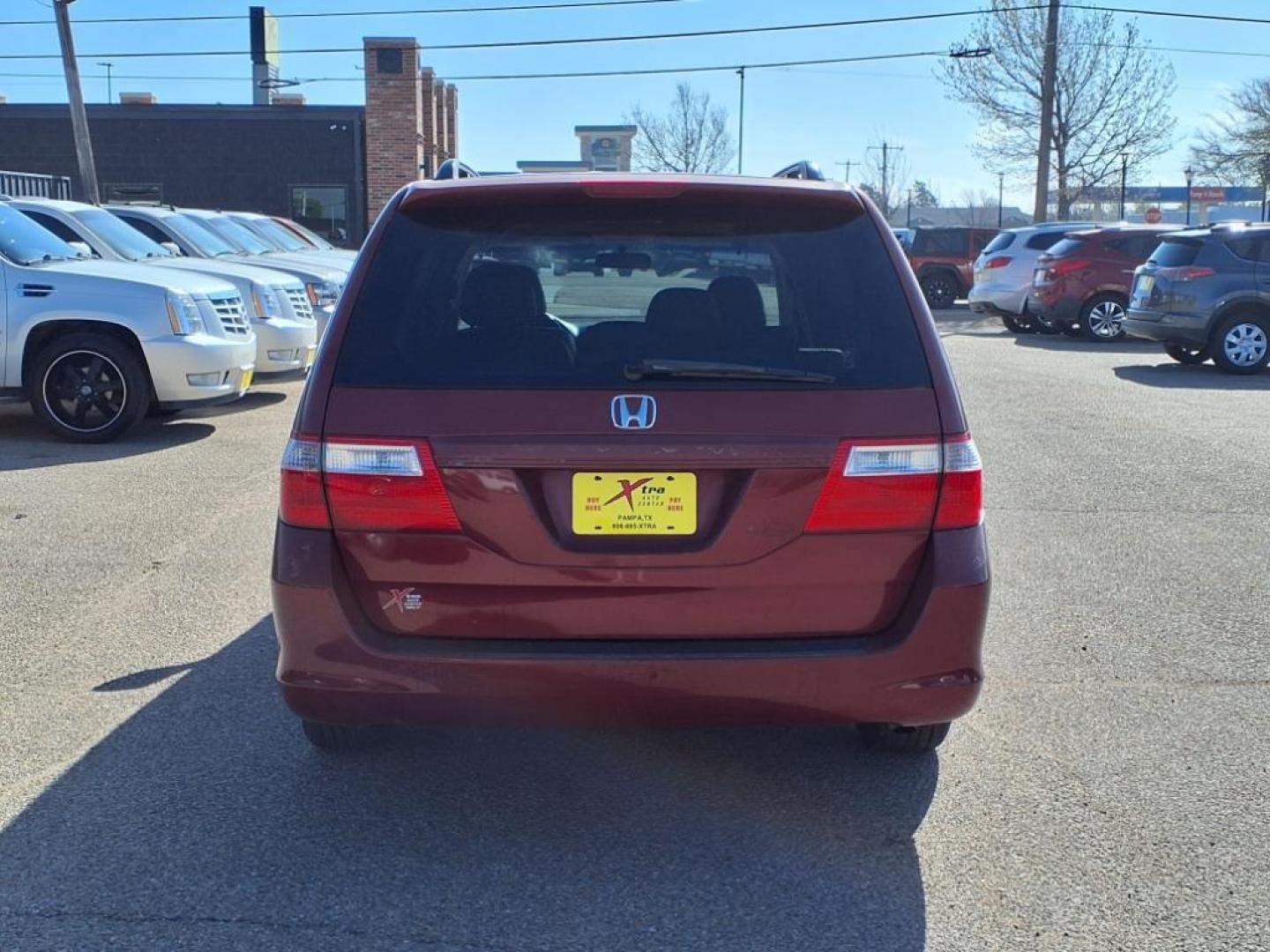 2006 Redrock Pearl Re Honda Odyssey EX-L w/DVD (5FNRL38706B) with an 3.5L 3L NA V6 single overhead cam (SOHC) 24V Fuel Injected engine, 5-Speed Automatic transmission, located at 1401 N. Hobart, Pampa, TX, 79065, (806) 665-9872, 35.549953, -100.975098 - Photo#3
