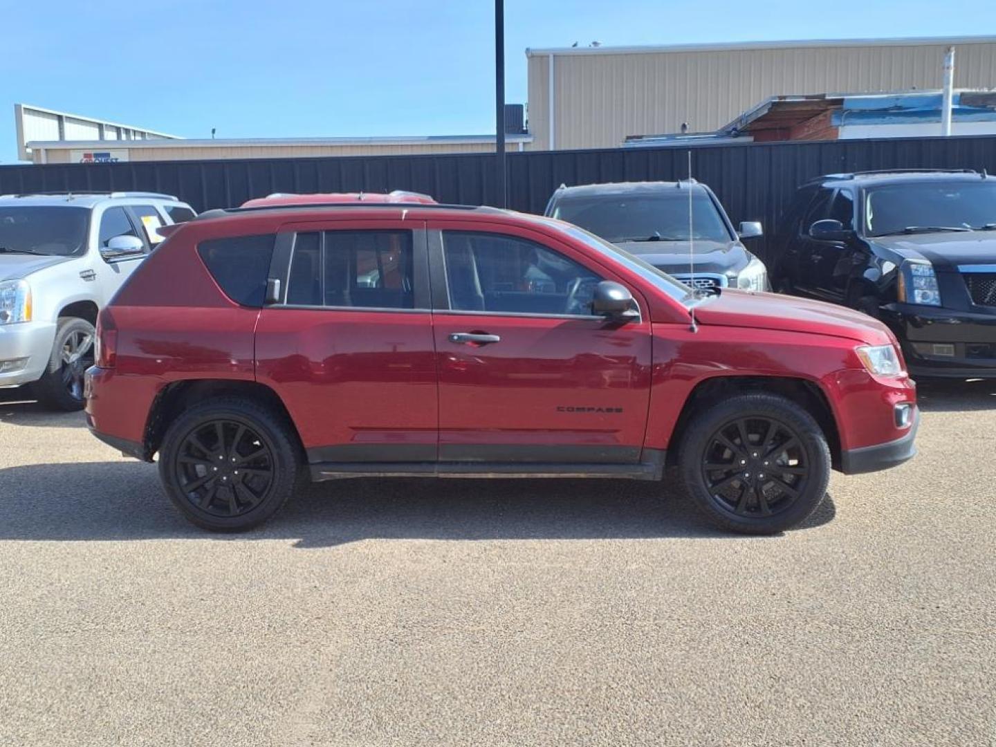 2015 Deep Cherry Red Crystal Pearl Coat Jeep Compass Altitude Edition (1C4NJCBAXFD) with an 2.0L 2.0L I4 158hp 141ft. lbs. Sequential Multiport Fuel Injection engine, CVT transmission, located at 1401 N. Hobart, Pampa, TX, 79065, (806) 665-9872, 35.549953, -100.975098 - Photo#2