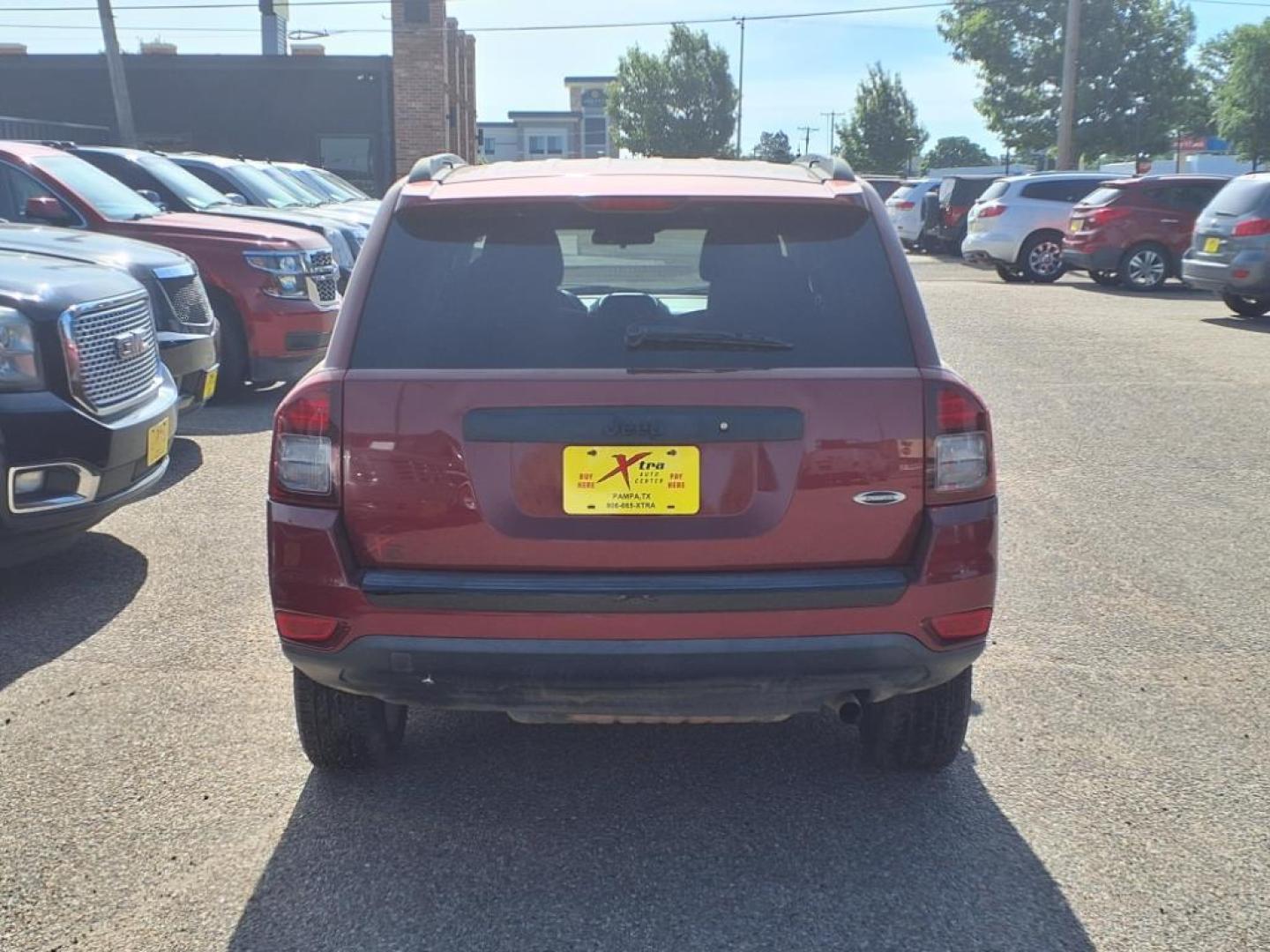 2015 Deep Cherry Red Crystal Pearl Coat Jeep Compass Altitude Edition (1C4NJCBAXFD) with an 2.0L 2.0L I4 158hp 141ft. lbs. Sequential Multiport Fuel Injection engine, CVT transmission, located at 1401 N. Hobart, Pampa, TX, 79065, (806) 665-9872, 35.549953, -100.975098 - Photo#3