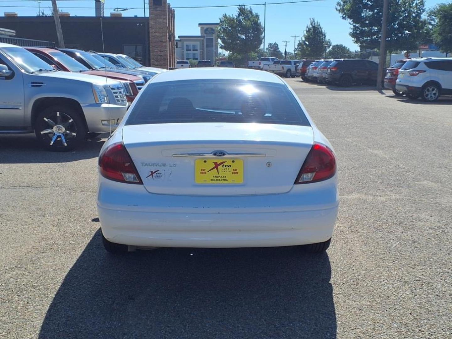 2003 Vibrant White Clearcoat Ford Taurus LX (1FAFP52U63G) with an 3.0L 3.0L NA V6 overhead valves (OHV) 12V Fuel Injected engine, 4-Speed Automatic transmission, located at 1401 N. Hobart, Pampa, TX, 79065, (806) 665-9872, 35.549953, -100.975098 - Photo#3