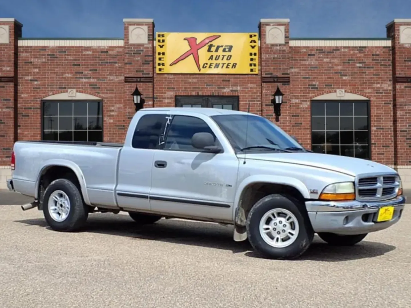 1999 Silver Dodge Dakota Club Cab 2WD (1B7GL22X5XS) with an Other engine, Automatic transmission, located at 1401 N. Hobart, Pampa, TX, 79065, (806) 665-9872, 35.549953, -100.975098 - **Rugged Yet Reliable: Discover the 1999 Dodge Dakota at Xtra Auto Center in Pampa, TX!**<br /> <br /> Are you an adventurous soul looking for the perfect pickup to accompany you on all your weekend escapades? Or perhaps you need a dependable vehicle that can handle your daily commute while providin - Photo#0