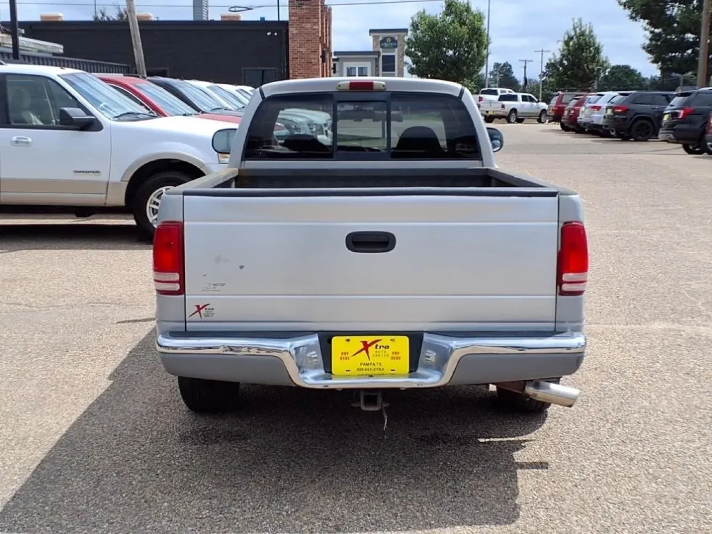 1999 Silver Dodge Dakota Club Cab 2WD (1B7GL22X5XS) with an Other engine, Automatic transmission, located at 1401 N. Hobart, Pampa, TX, 79065, (806) 665-9872, 35.549953, -100.975098 - **Rugged Yet Reliable: Discover the 1999 Dodge Dakota at Xtra Auto Center in Pampa, TX!**<br /> <br /> Are you an adventurous soul looking for the perfect pickup to accompany you on all your weekend escapades? Or perhaps you need a dependable vehicle that can handle your daily commute while providin - Photo#3