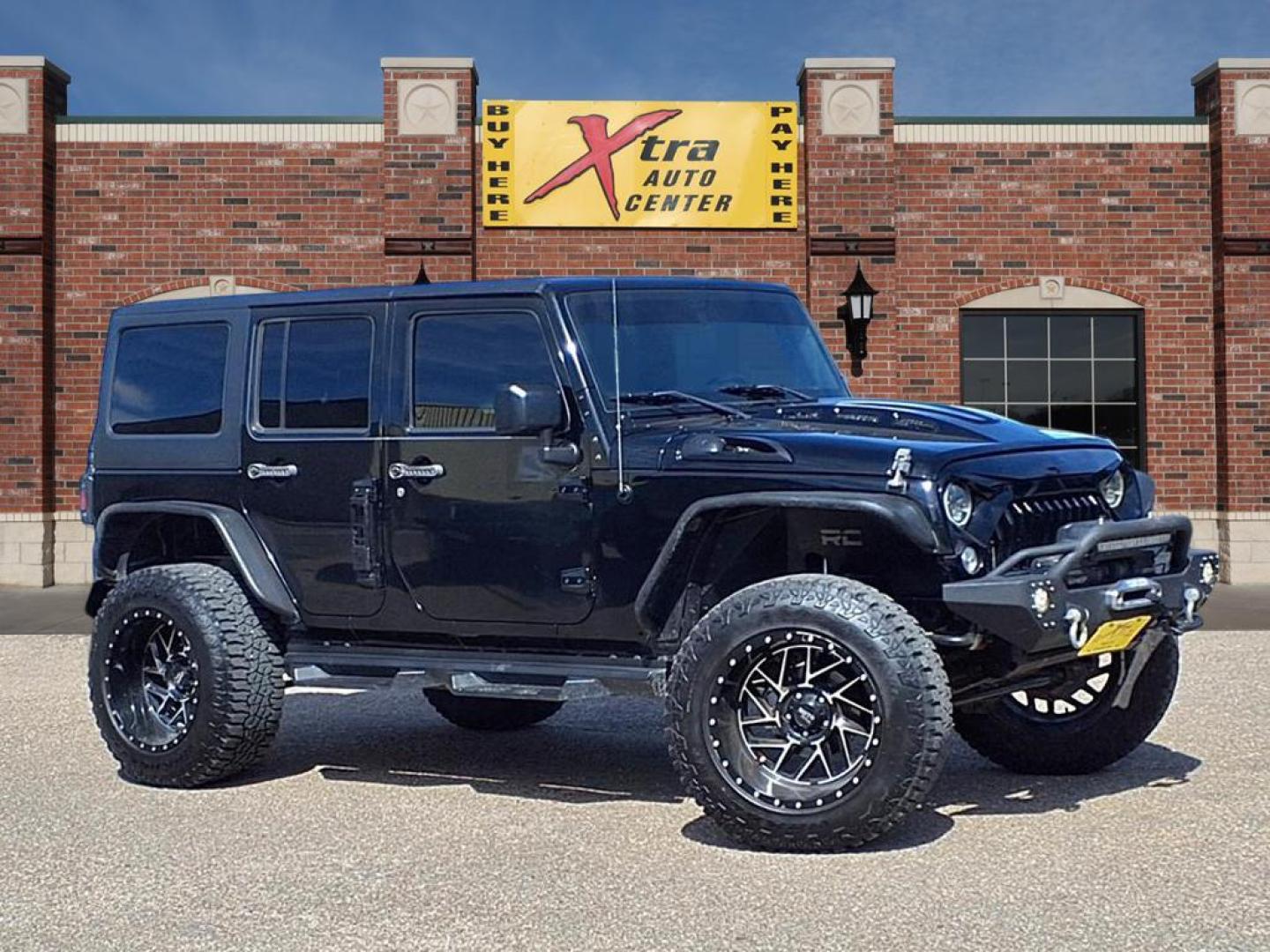 2015 Black Clear Coat Jeep Wrangler Unlimited Sahara (1C4HJWEG3FL) with an 3.6L 3.6L V6 285hp 260ft. lbs. Sequential Multiport Fuel Injection engine, 5-Speed Automatic transmission, located at 1401 N. Hobart, Pampa, TX, 79065, (806) 665-9872, 35.549953, -100.975098 - Photo#0