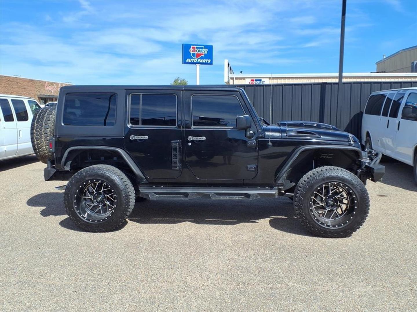 2015 Black Clear Coat Jeep Wrangler Unlimited Sahara (1C4HJWEG3FL) with an 3.6L 3.6L V6 285hp 260ft. lbs. Sequential Multiport Fuel Injection engine, 5-Speed Automatic transmission, located at 1401 N. Hobart, Pampa, TX, 79065, (806) 665-9872, 35.549953, -100.975098 - Photo#2