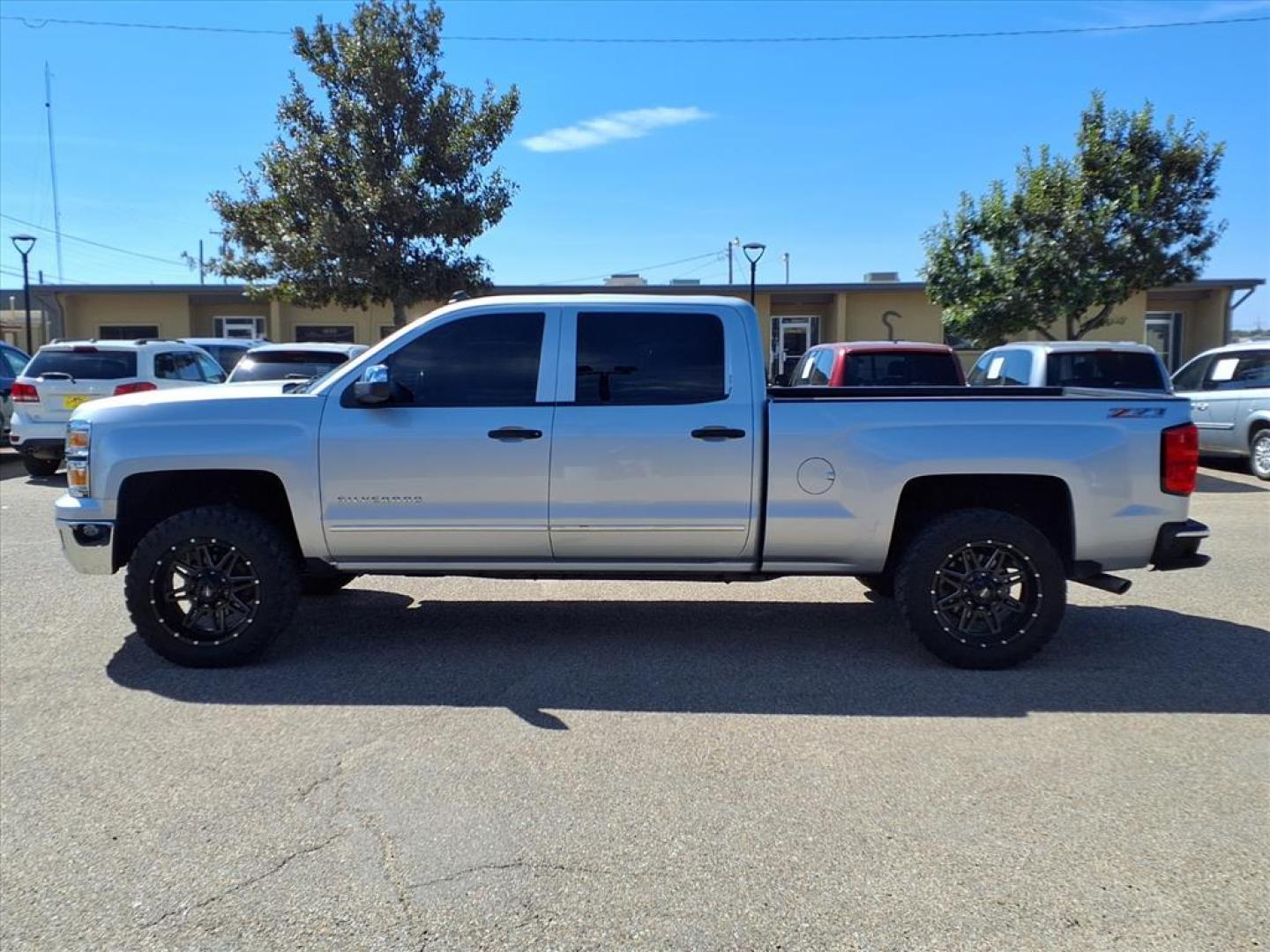 2014 Silver Ice Metallic Chevrolet Silverado 1500 LT Z71 (3GCUKRECXEG) with an 5.3L EcoTec3 5.3L Flex Fuel V8 355hp 383ft. lbs. Direct Injection engine, 6-Speed Shiftable Automatic w/Overdrive transmission, located at 1401 N. Hobart, Pampa, TX, 79065, (806) 665-9872, 35.549953, -100.975098 - Photo#4