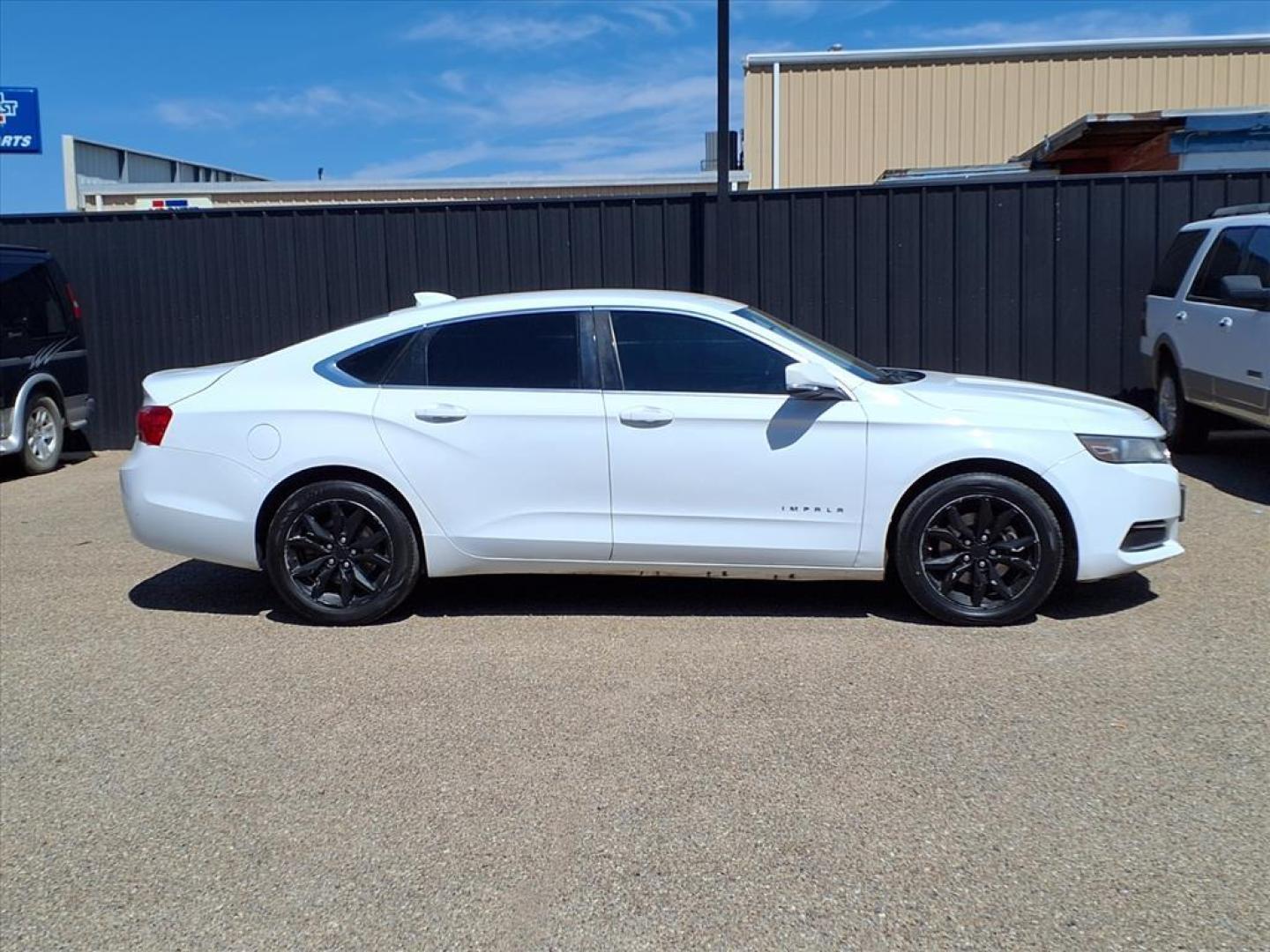 2016 Summit White Chevrolet Impala LT (2G1115S3XG9) with an 3.6L 3.6L Flex Fuel V6 305hp 264ft. lbs. Direct Injection engine, 6-Speed Shiftable Automatic w/Overdrive transmission, located at 1401 N. Hobart, Pampa, TX, 79065, (806) 665-9872, 35.549953, -100.975098 - Photo#2