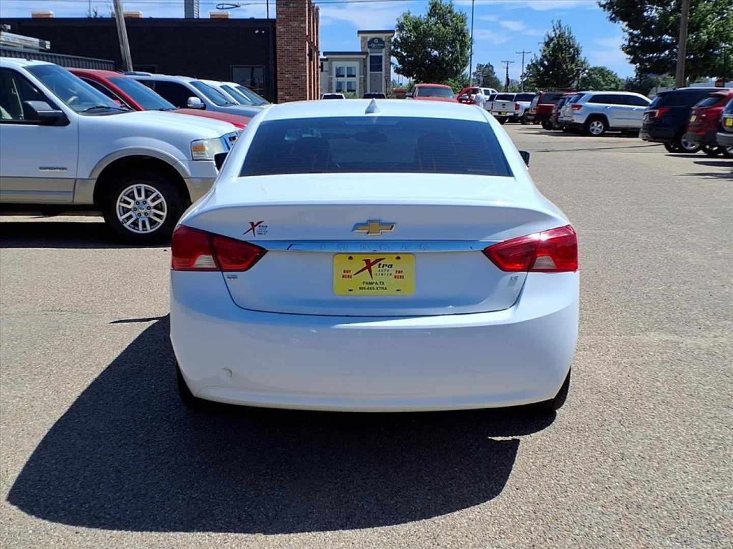 2016 Summit White Chevrolet Impala LT (2G1115S3XG9) with an 3.6L 3.6L Flex Fuel V6 305hp 264ft. lbs. Direct Injection engine, 6-Speed Shiftable Automatic w/Overdrive transmission, located at 1401 N. Hobart, Pampa, TX, 79065, (806) 665-9872, 35.549953, -100.975098 - Photo#3