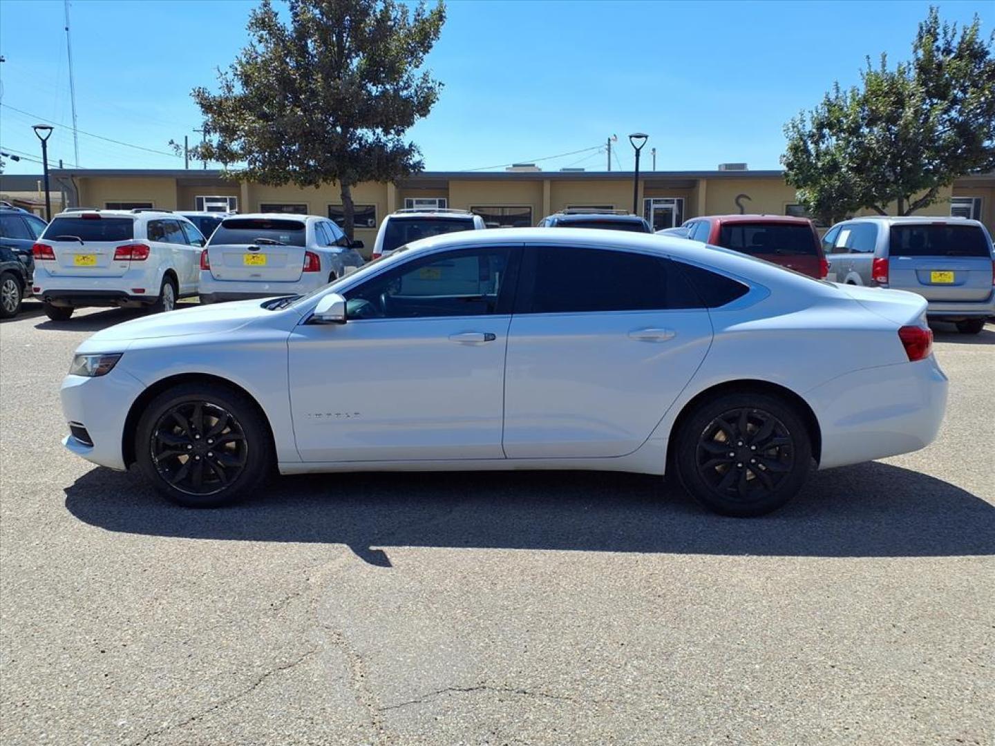 2016 Summit White Chevrolet Impala LT (2G1115S3XG9) with an 3.6L 3.6L Flex Fuel V6 305hp 264ft. lbs. Direct Injection engine, 6-Speed Shiftable Automatic w/Overdrive transmission, located at 1401 N. Hobart, Pampa, TX, 79065, (806) 665-9872, 35.549953, -100.975098 - Photo#4