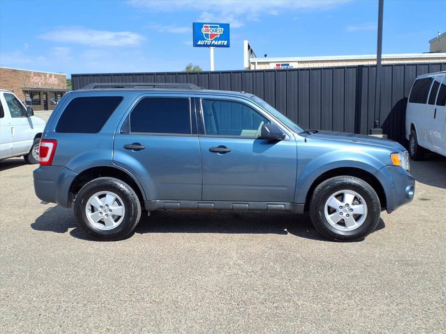 2011 Steel Blue Metallic Ford Escape XLT (1FMCU0DG1BK) with an 3.0L 3.0L Flex Fuel V6 240hp 223ft. lbs. Sequential Multiport Fuel Injection engine, 6-Speed Automatic transmission, located at 1401 N. Hobart, Pampa, TX, 79065, (806) 665-9872, 35.549953, -100.975098 - Photo#2