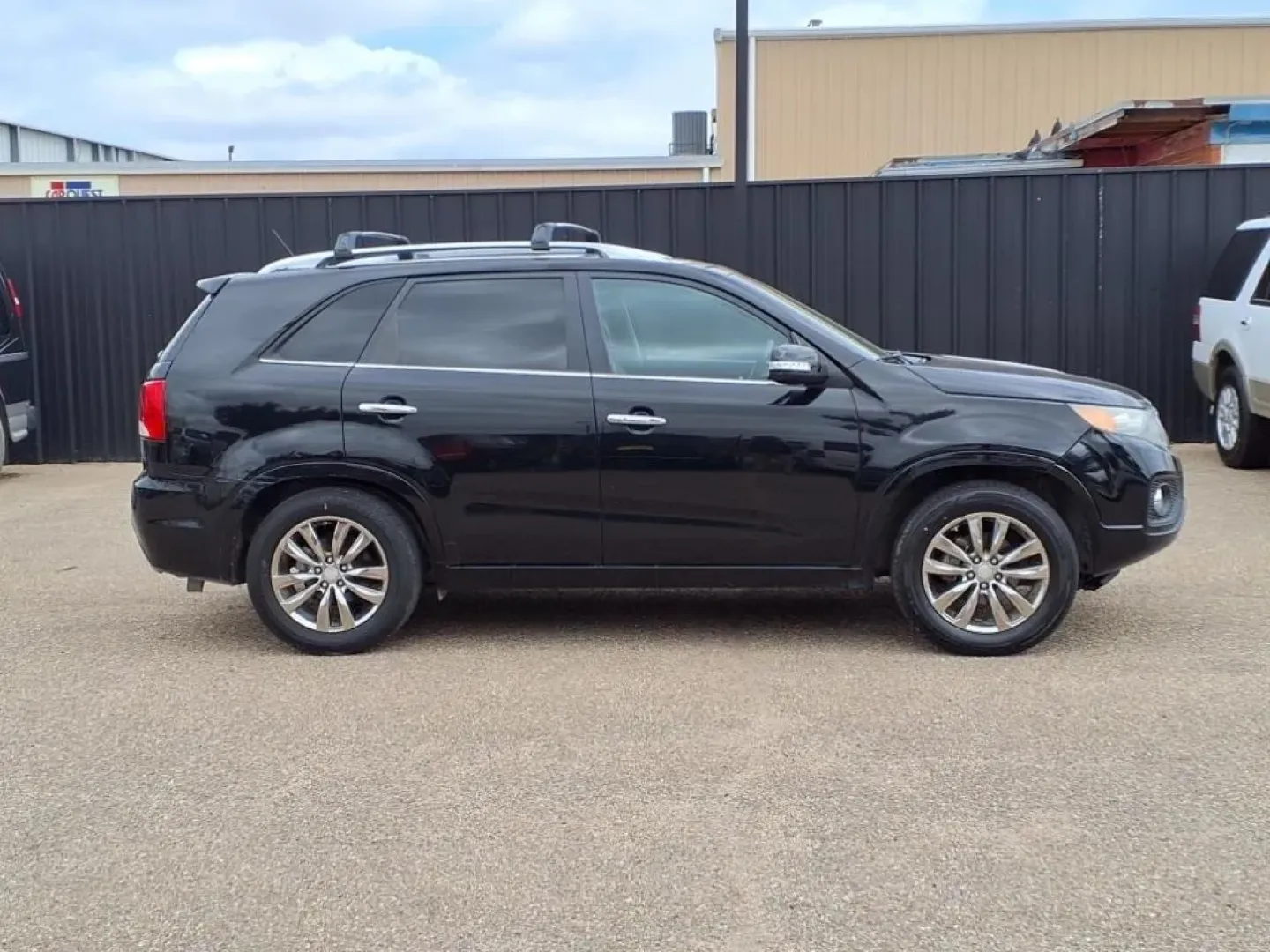 2013 Ebony Black Kia Sorento SX 2WD (5XYKW4A21DG) with an Other engine, located at 1401 N. Hobart, Pampa, TX, 79065, (806) 665-9872, 35.549953, -100.975098 - If you're seeking the perfect vehicle for weekend adventures or family outings, look no further than this 2013 Kia Sorento SX 2WD, available now at Xtra Auto Center in Pampa, TX. This SUV is designed to accommodate all your needs, whether it's a road trip to the stunning Palo Duro Canyon or daily co - Photo#2