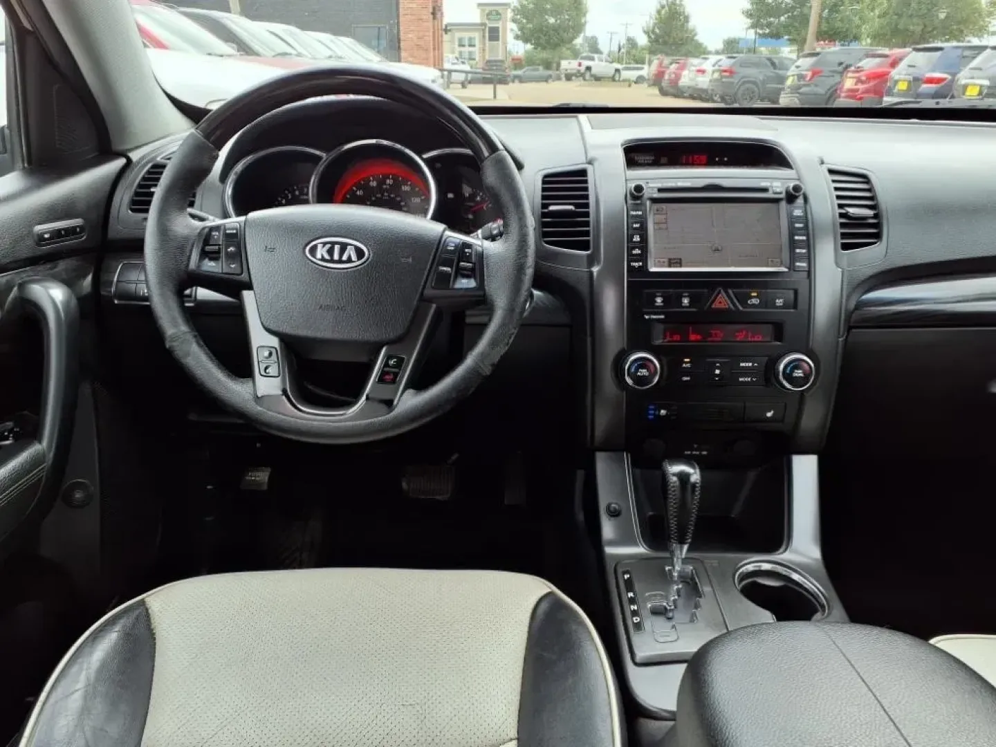 2013 Ebony Black Kia Sorento SX 2WD (5XYKW4A21DG) with an Other engine, located at 1401 N. Hobart, Pampa, TX, 79065, (806) 665-9872, 35.549953, -100.975098 - If you're seeking the perfect vehicle for weekend adventures or family outings, look no further than this 2013 Kia Sorento SX 2WD, available now at Xtra Auto Center in Pampa, TX. This SUV is designed to accommodate all your needs, whether it's a road trip to the stunning Palo Duro Canyon or daily co - Photo#11