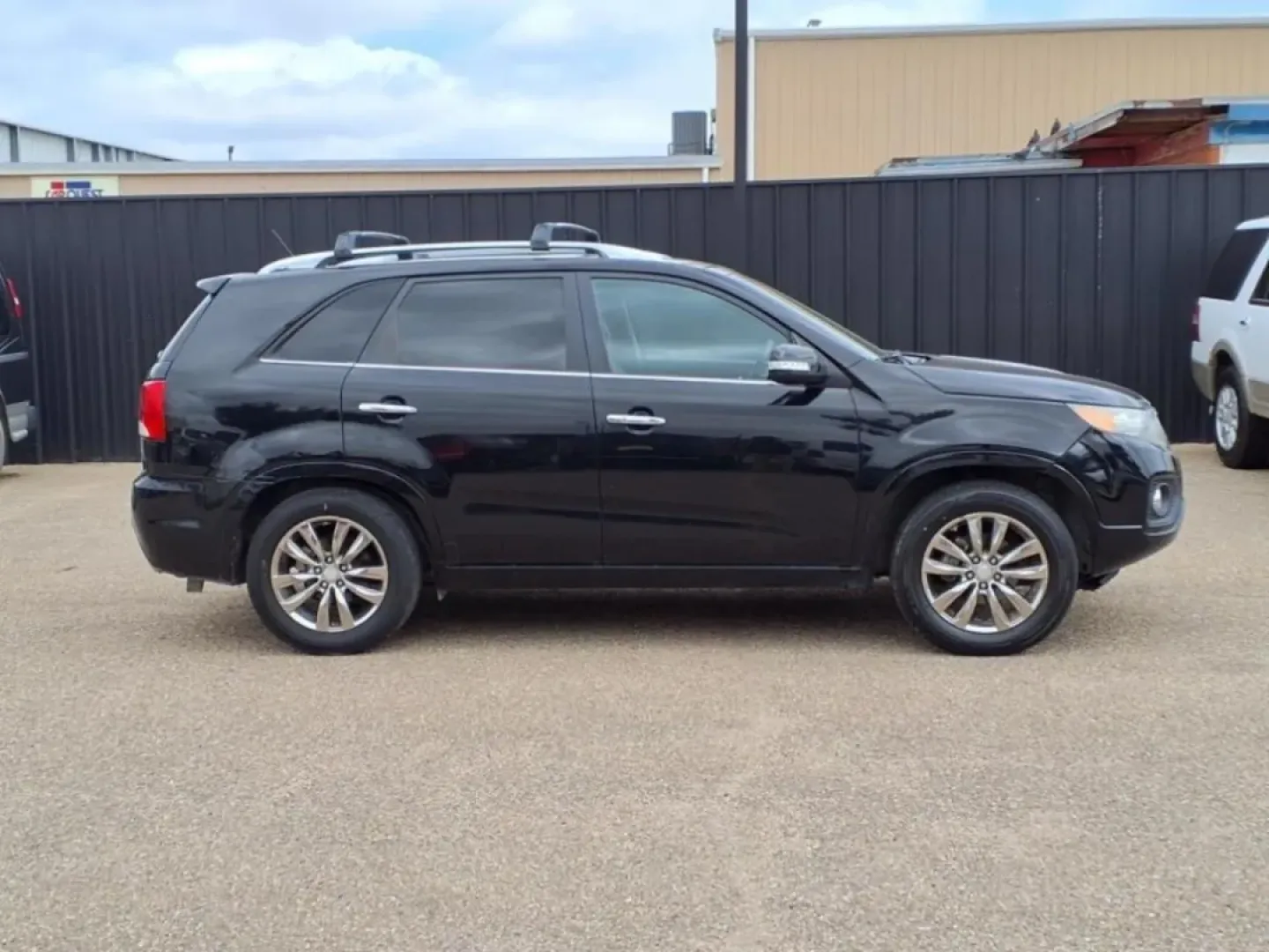 2013 Ebony Black Kia Sorento SX 2WD (5XYKW4A21DG) with an Other engine, Automatic transmission, located at 1401 N. Hobart, Pampa, TX, 79065, (806) 665-9872, 35.549953, -100.975098 - If you're seeking the perfect vehicle for weekend adventures or family outings, look no further than this 2013 Kia Sorento SX 2WD, available now at Xtra Auto Center in Pampa, TX. This SUV is designed to accommodate all your needs, whether it's a road trip to the stunning Palo Duro Canyon or daily co - Photo#2