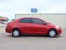 2011 Barcelona Red Metallic Toyota Yaris Base (JTDBT4K34B1) with an 1.5 4 Cylinder Sequential Multiport Fuel Injection engine, Automatic transmission, located at 1401 N. Hobart, Pampa, TX, 79065, (806) 665-9872, 35.549641, -100.971878 - Photo #2