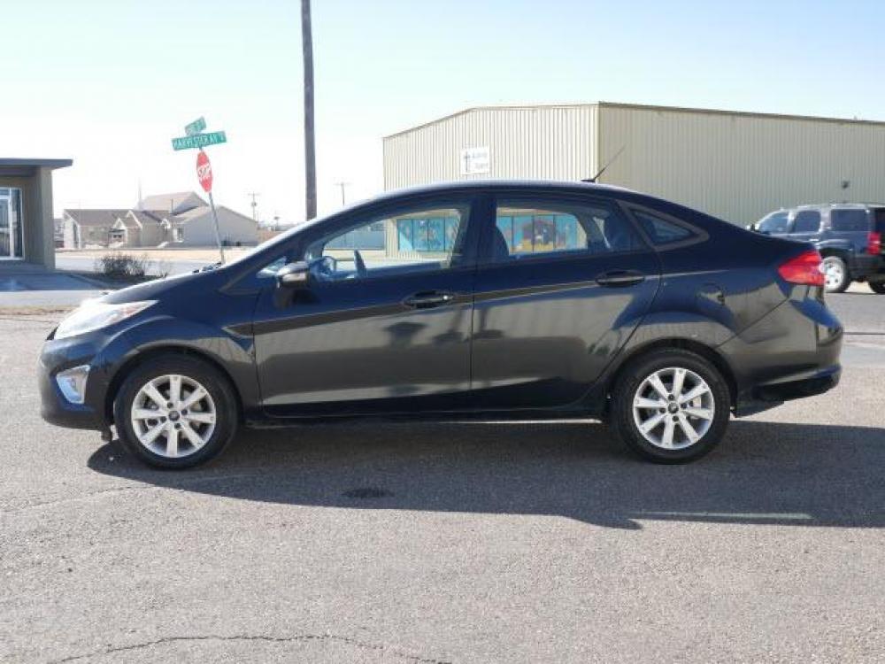 2011 Tuxedo Black Ford Fiesta SEL (3FADP4CJ5BM) with an 1.6 4 Cylinder Sequential Multiport Fuel Injection engine, Automatic transmission, located at 1401 N. Hobart, Pampa, TX, 79065, (806) 665-9872, 35.549641, -100.971878 - Photo #4