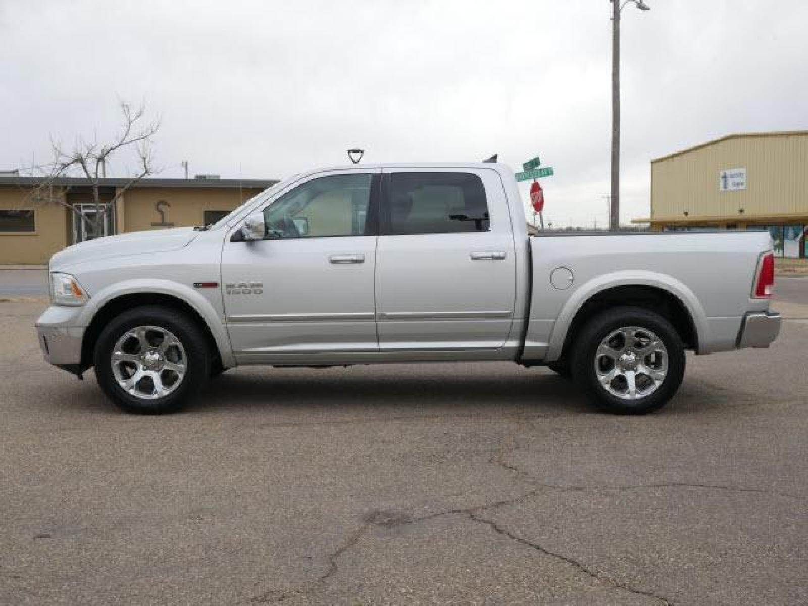 2015 Bright Silver Metallic Clear Coat RAM 1500 Laramie (1C6RR7NM2FS) with an 3.0 6 Cylinder Common Rail Direct Injection engine, Automatic transmission, located at 1401 N. Hobart, Pampa, TX, 79065, (806) 665-9872, 35.549641, -100.971878 - Photo #4