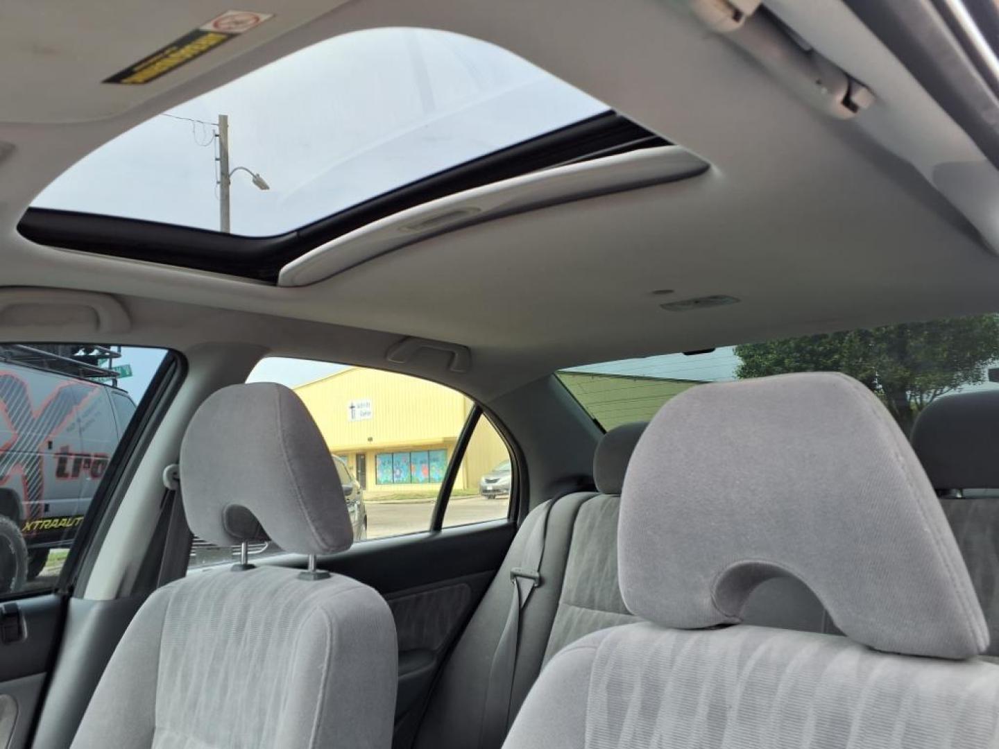 2004 Nighthawk Black Pearl Bk Honda Civic EX (JHMES26744S) with an 1.7L 1L NA I4 single overhead cam (SOHC) 16V Fuel Injected engine, 4-Speed Automatic transmission, located at 1401 N. Hobart, Pampa, TX, 79065, (806) 665-9872, 35.549953, -100.975098 - Photo#5