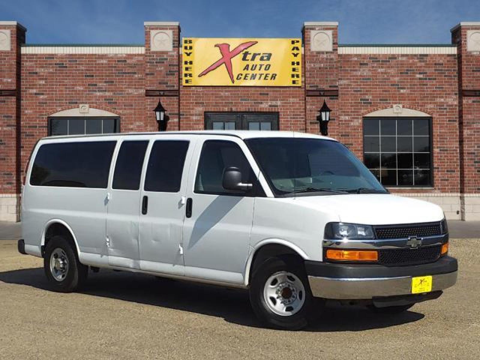 2012 Summit White Chevrolet Express Passenger LT 3500 (1GAZG1FG9C1) with an 6.0L 4.8L Flex Fuel V8 280hp 2 Sequential-Port F.I. engine, 6-Speed Shiftable Automatic transmission, located at 1401 N. Hobart, Pampa, TX, 79065, (806) 665-9872, 35.549641, -100.971878 - Photo #0