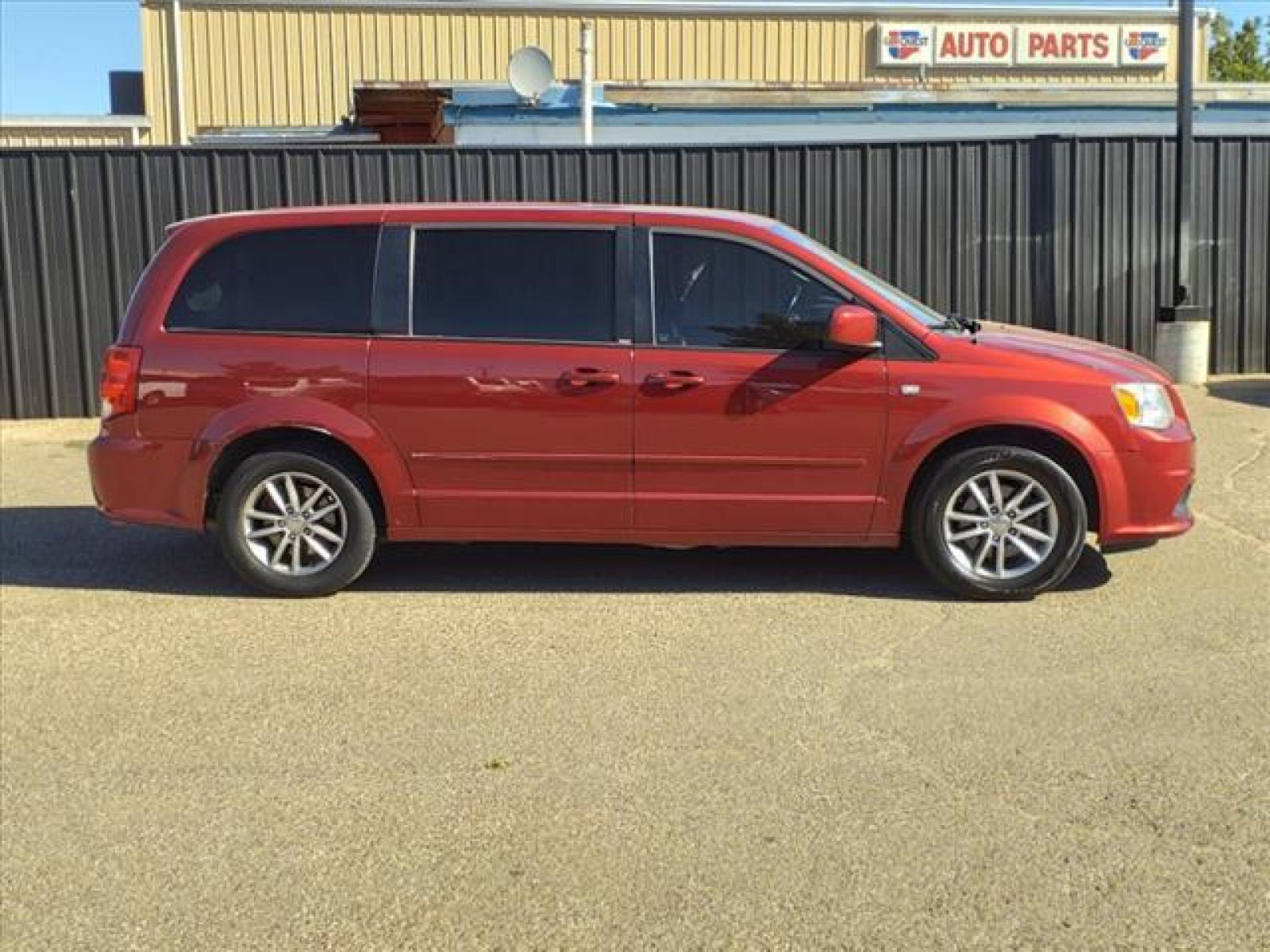 2014 Deep Cherry Red Crystal Pearl Coat Dodge Grand Caravan SE 30th Anniversary (2C4RDGBG8ER) with an Pentastar 3.6L Flex Fuel Sequential Multiport Fuel Injection engine, 6-Speed Shiftable Automatic transmission, located at 1401 N. Hobart, Pampa, TX, 79065, (806) 665-9872, 35.549641, -100.971878 - Photo #2