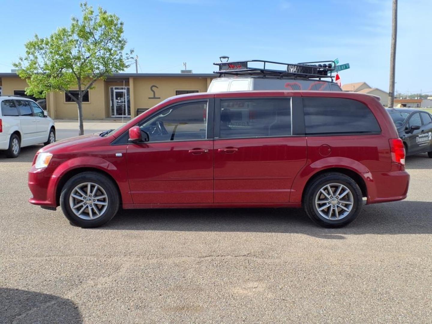 2014 Deep Cherry Red Crystal Pearl Coat Prp Dodge Grand Caravan SE 30th Anniversary (2C4RDGBG8ER) with an 3.6L Pentastar 3.6L Flex Fuel V6 283hp 260ft. lbs. Sequential Multiport Fuel Injection engine, 6-Speed Shiftable Automatic transmission, located at 1401 N. Hobart, Pampa, TX, 79065, (806) 665-9872, 35.549953, -100.975098 - Photo#4