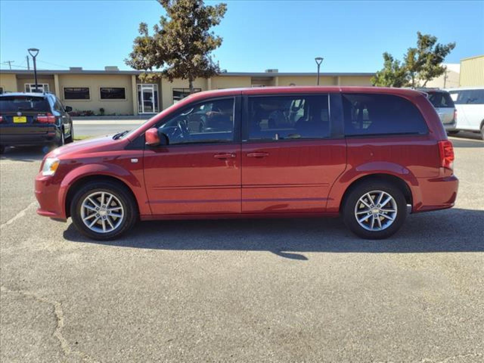 2014 Deep Cherry Red Crystal Pearl Coat Dodge Grand Caravan SE 30th Anniversary (2C4RDGBG8ER) with an Pentastar 3.6L Flex Fuel Sequential Multiport Fuel Injection engine, 6-Speed Shiftable Automatic transmission, located at 1401 N. Hobart, Pampa, TX, 79065, (806) 665-9872, 35.549641, -100.971878 - Photo #4