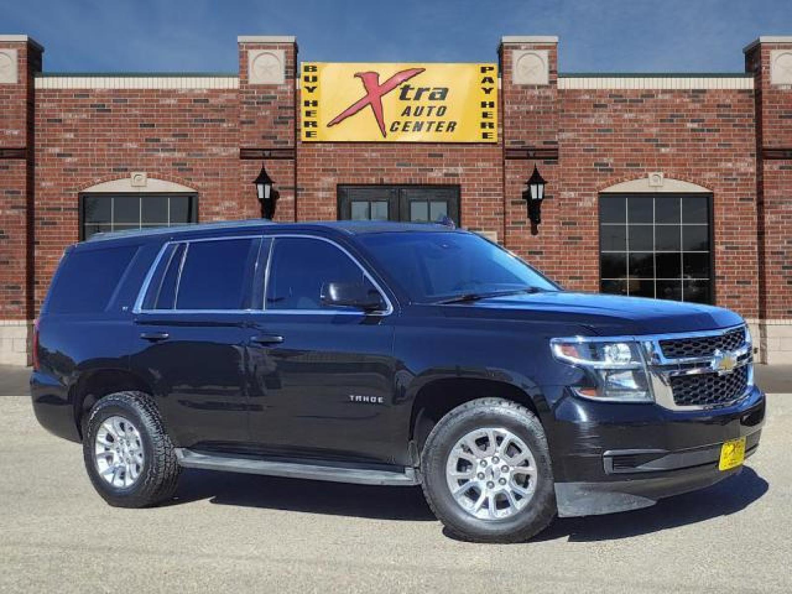 2015 Black Chevrolet Tahoe LT (1GNSCBKC9FR) with an 5.3L EcoTec3 5.3L Flex Fuel V8 Direct Injection engine, 6-Speed Shiftable Automatic w/Overdrive transmission, located at 1401 N. Hobart, Pampa, TX, 79065, (806) 665-9872, 35.549641, -100.971878 - Photo #0