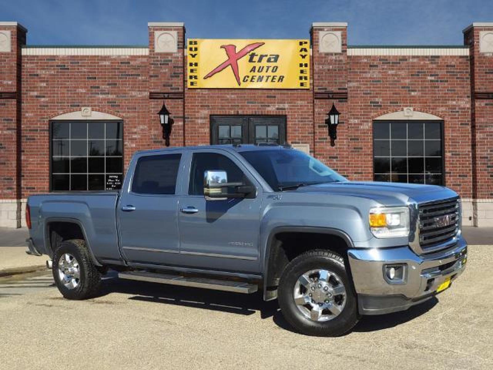 2016 Light Steel Gray Metallic GMC Sierra 2500HD SLT (1GT12TE85GF) with an 6.6L Duramax 6.6L Diesel Turbo Common Rail Direct Injection engine, Allison 1000 6-Speed Shiftable Automatic transmission, located at 1401 N. Hobart, Pampa, TX, 79065, (806) 665-9872, 35.549641, -100.971878 - Photo #0
