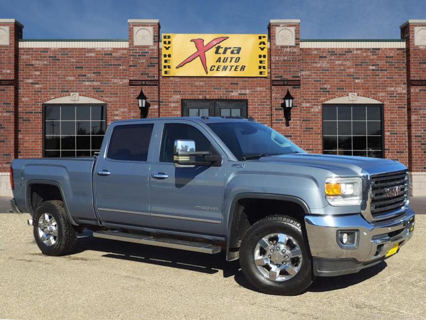 2016 Light Steel Gray Metallic GMC Sierra 2500HD SLT (1GT12TE85GF) with an 6.6L Duramax 6.6L Diesel Turbo V8 397hp 765ft. lbs. Common Rail Direct Injection engine, Allison 1000 6-Speed Shiftable Automatic transmission, located at 1401 N. Hobart, Pampa, TX, 79065, (806) 665-9872, 35.549953, -100.975098 - Photo#0