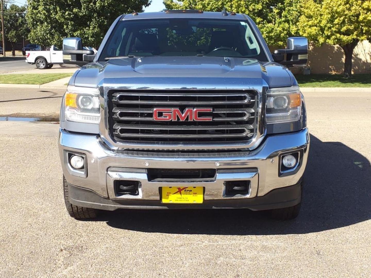 2016 Light Steel Gray Metallic GMC Sierra 2500HD SLT (1GT12TE85GF) with an 6.6L Duramax 6.6L Diesel Turbo V8 397hp 765ft. lbs. Common Rail Direct Injection engine, Allison 1000 6-Speed Shiftable Automatic transmission, located at 1401 N. Hobart, Pampa, TX, 79065, (806) 665-9872, 35.549953, -100.975098 - Photo#1